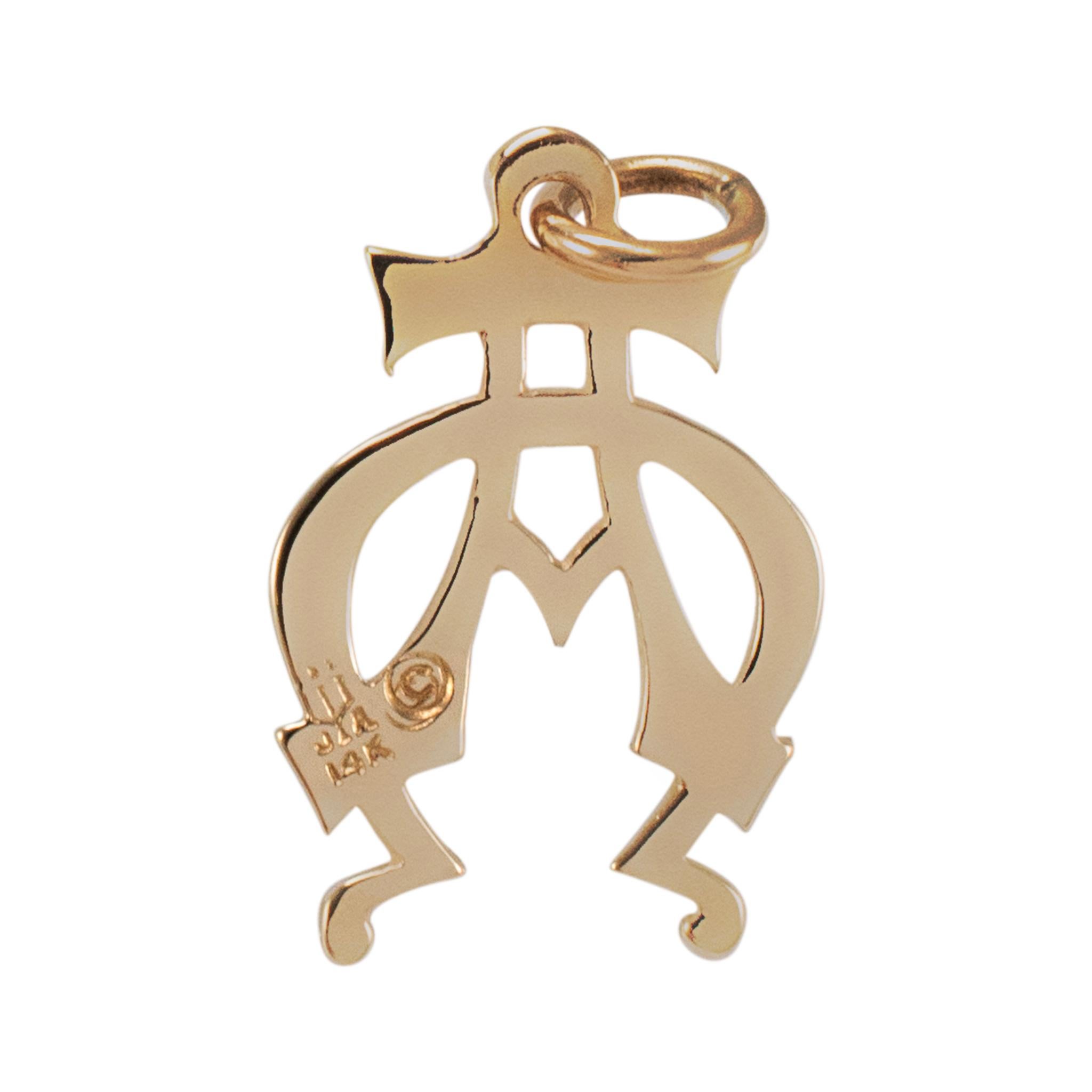 Gender: Ladies

Metal Type: 14K Yellow Gold

Length: 0.75 inches

Weight: 1.44 grams

14K yellow gold pendant. Engraved with 