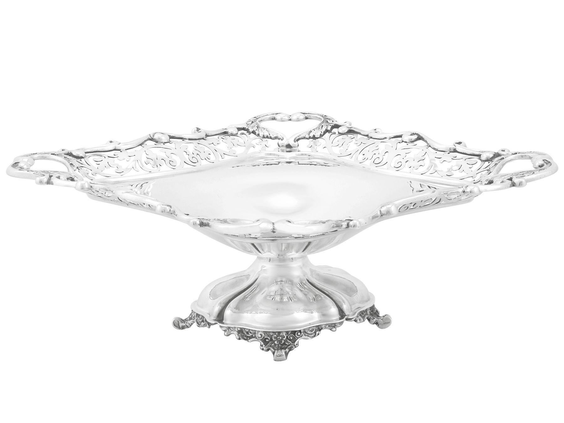 An exceptional, fine and impressive antique Edwardian English sterling silver dish; an addition to our ornamental silverware collection.

This exceptional antique Edwardian sterling silver dish has a square shaped rounded plain form onto a domed