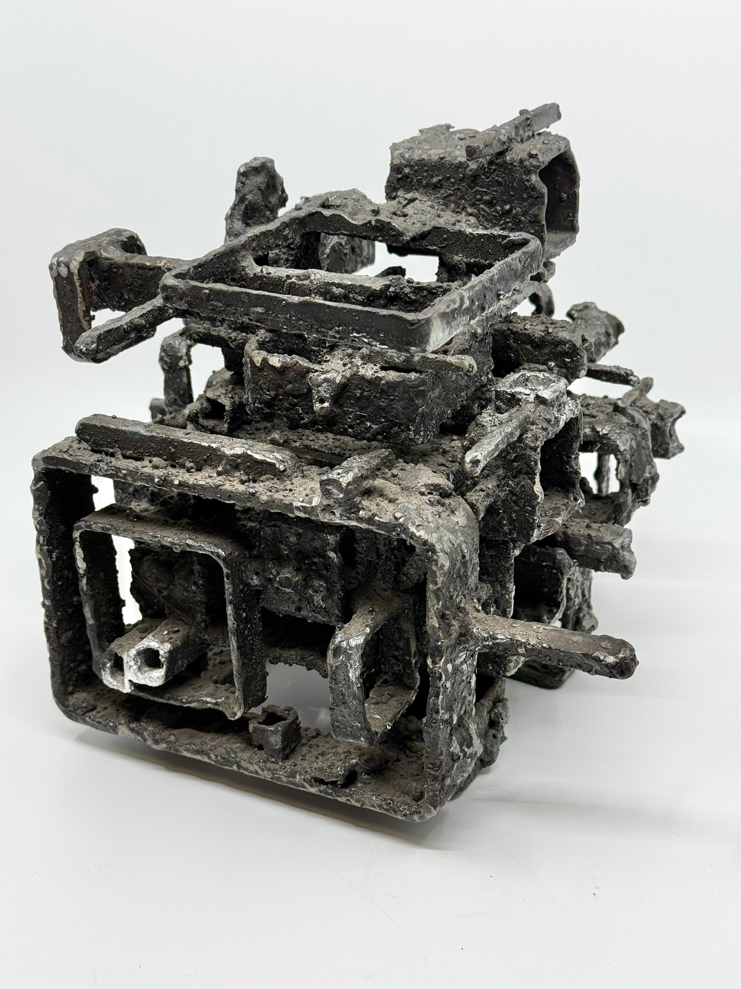 A striking brutalist blackened steel box by the talented Iowa artist James Bearden. It is titled the “Dwelling: box and dates to 2015. The top lifts off and fits securely. A few spots on the edges have been polished.
In good condition with minor