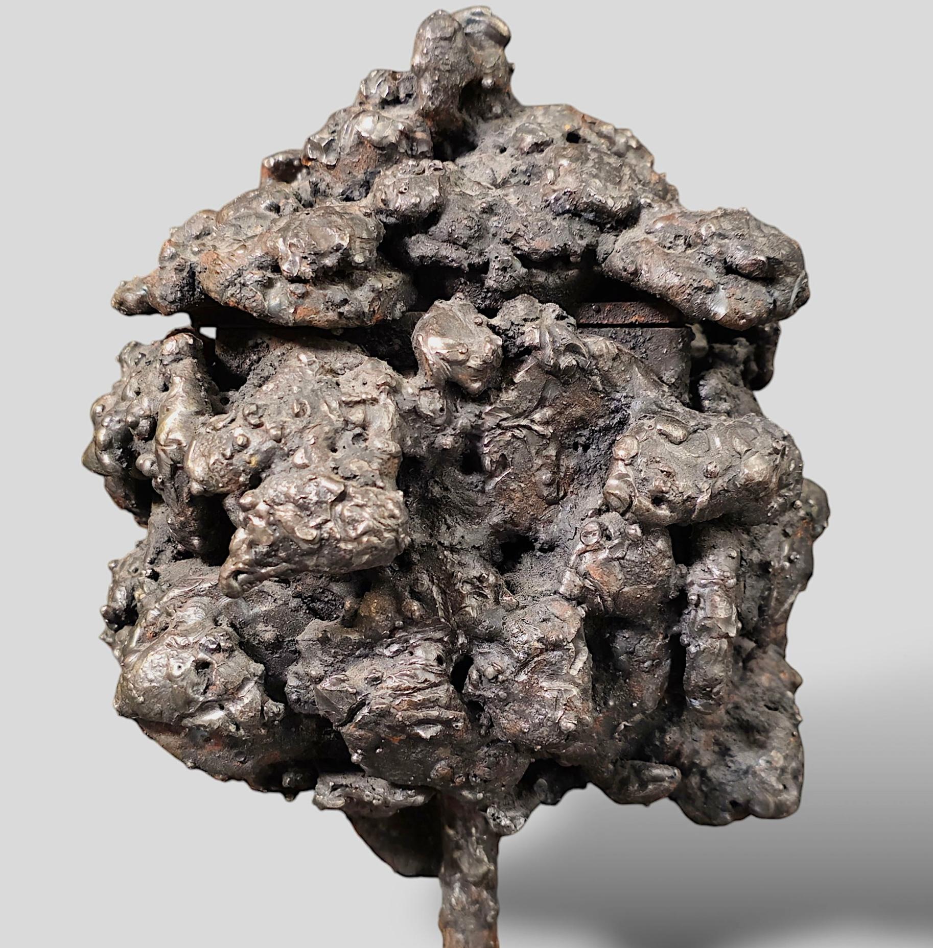 A clever fitted sculptured steel box in the Brutalist style by the noted Des Moine Iowa artist James Bearden. Titled “Barnacle Box,” the piece was acquired directly from the rtist. The box fits together perfectly. It is monogrammed under the lid.