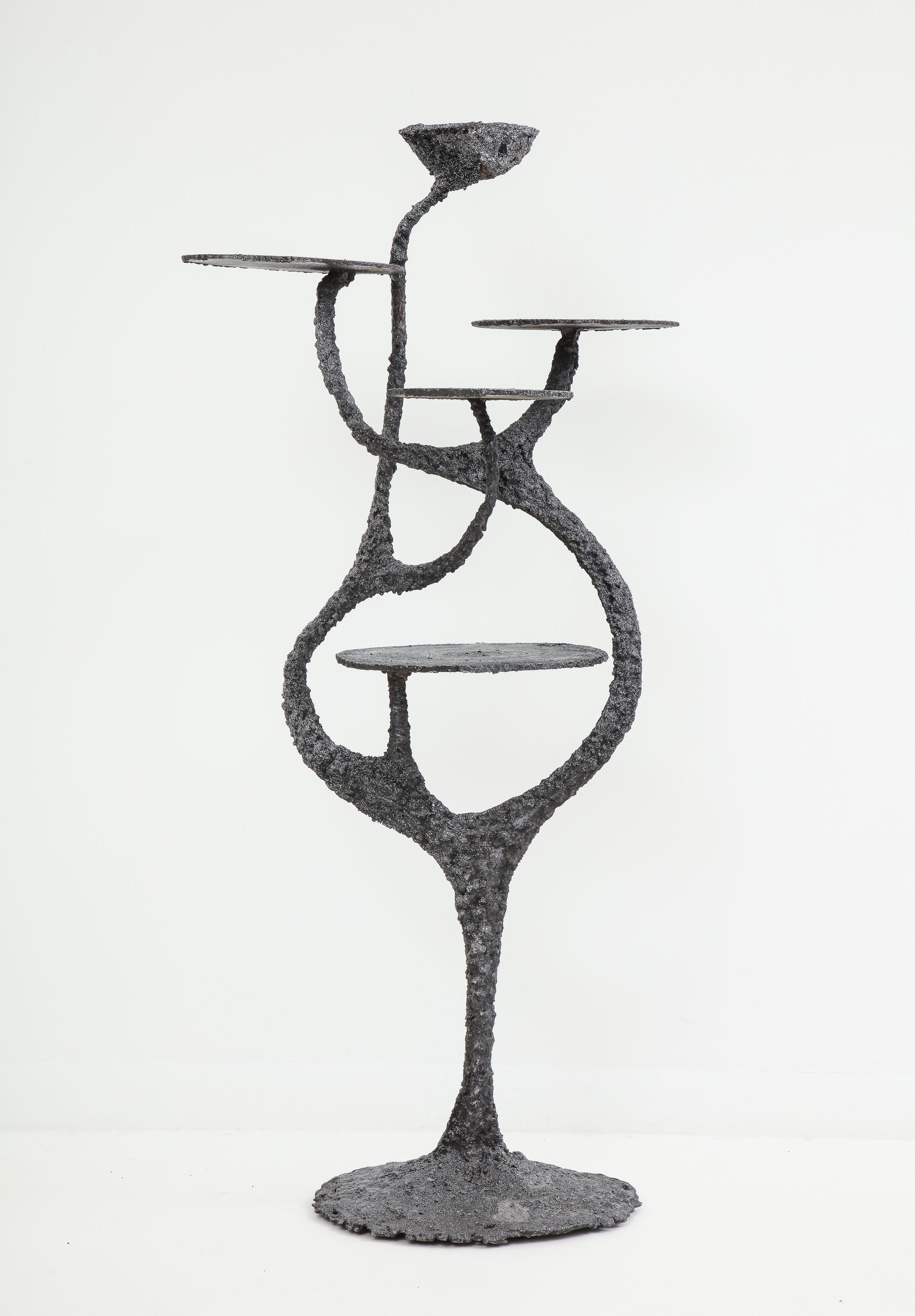 Stand or étagère of blackened steel with an ash metallic wash by American artist James Bearden, made in 2017. An early entry from his sinuous Medusa series, with five round surfaces for display. Bearden's work was featured in a 2020 solo exhibition