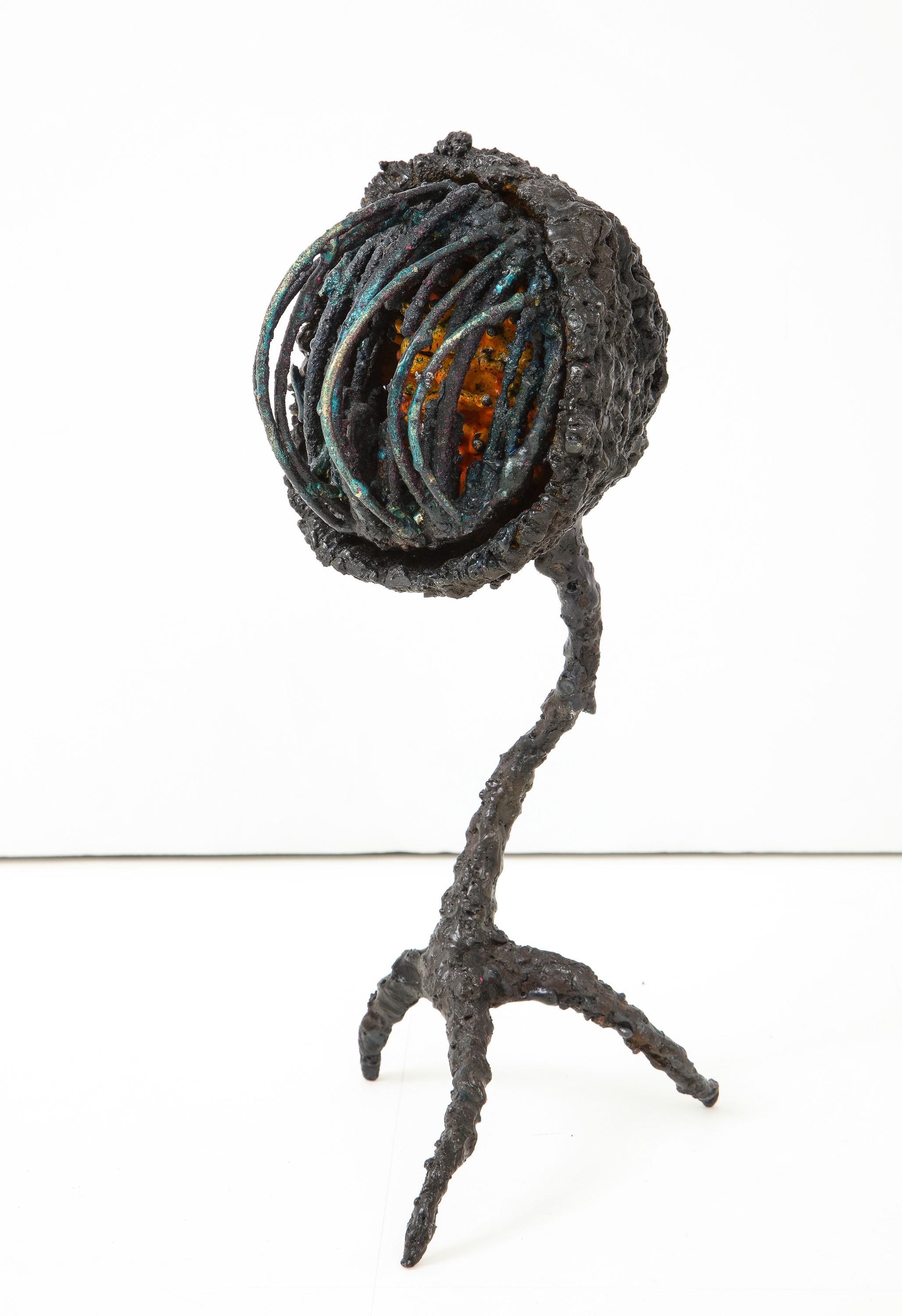 “Coil Box,” a dynamic abstract sculpture of torch-cut steel with glass enamel and dyed bronze, by American artist James Bearden. From his Woven series., 2018. The quasi-anthropomorphic, quasi-mechanical form radiates a dramatic energy from its talon