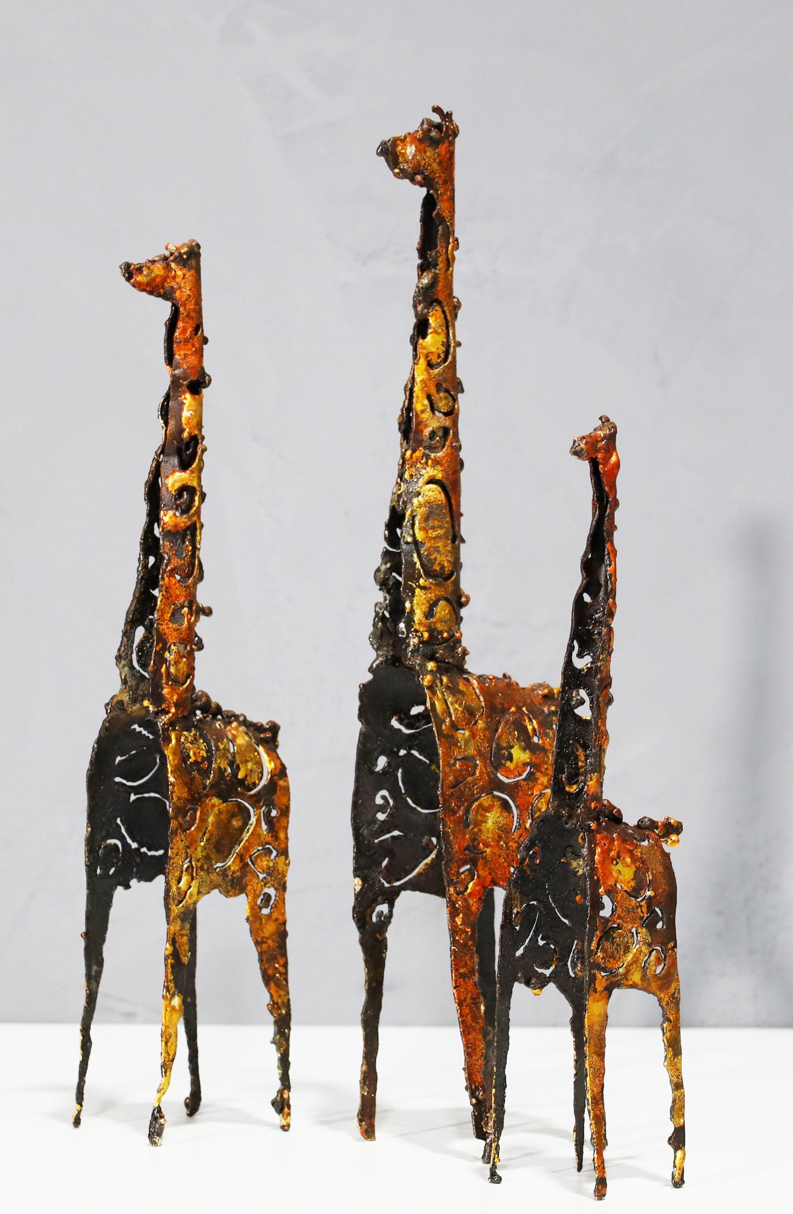 Brutalist style giraffe sculptures by James Bearden. Signed JB on the underside of one giraffe. Measurements of each as follows:

Measures: 17.75