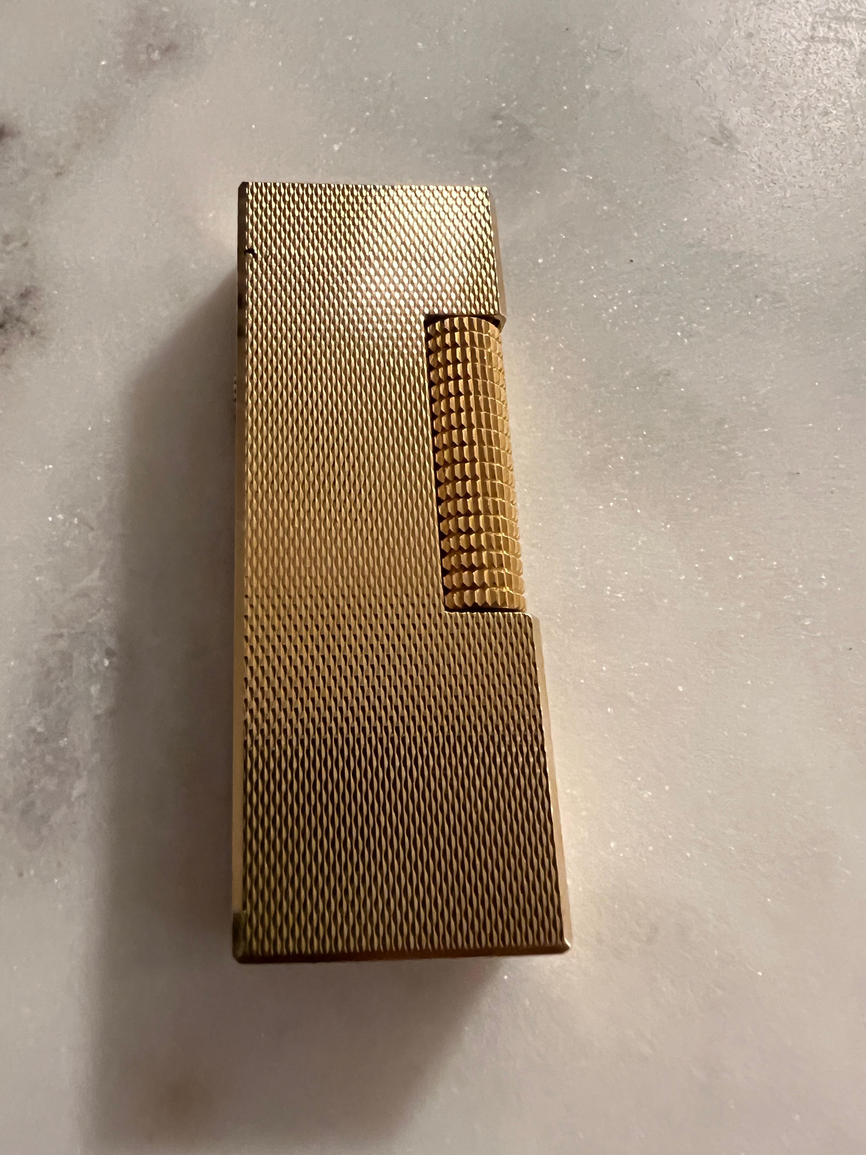 The James Bond Iconic and Rare Vintage Dunhill Gold and Swiss Made Lighter 7