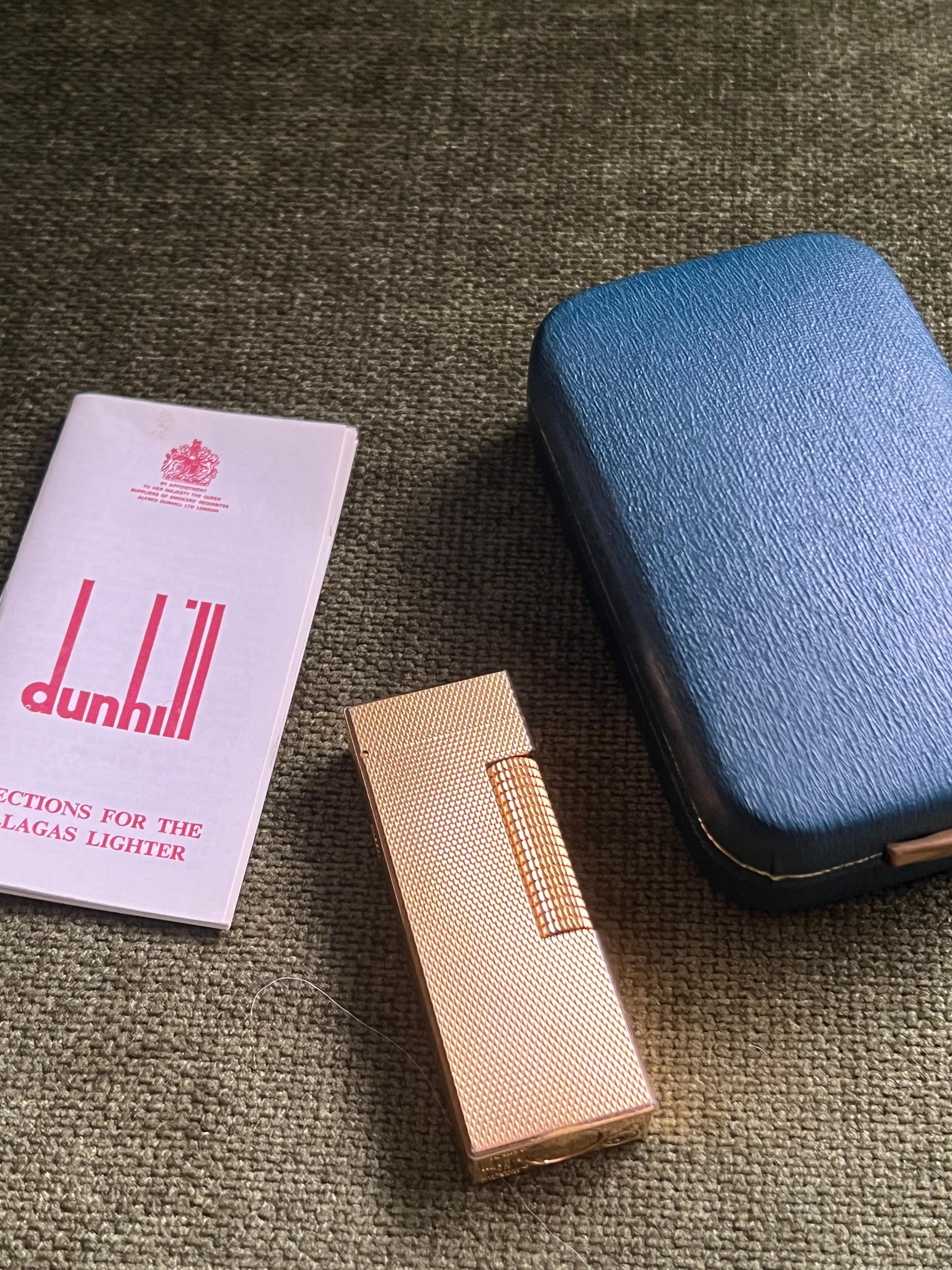 Rare Vintage Dunhill gold plated Swiss Made lighter In mint condition.
Works perfectly. 
Iconic and beautifully engineered piece rare condition, James Bond lighter of choice. 
In original box which is Sky blue. 
Original paper certificate in box.