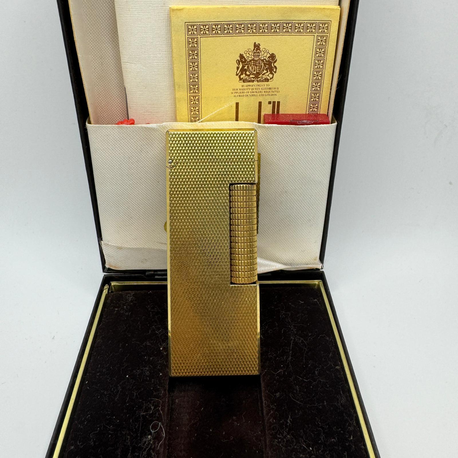 Rare Iconic Vintage and Elegant Dunhill 18K Gold Plated 
Circa 1980s 
Swiss Made Lighter
The James Bond lighter of choice 
In mint condition.
Works perfectly. 
Iconic and beautifully engineered piece in rare condition.
In original BRITISH Case with