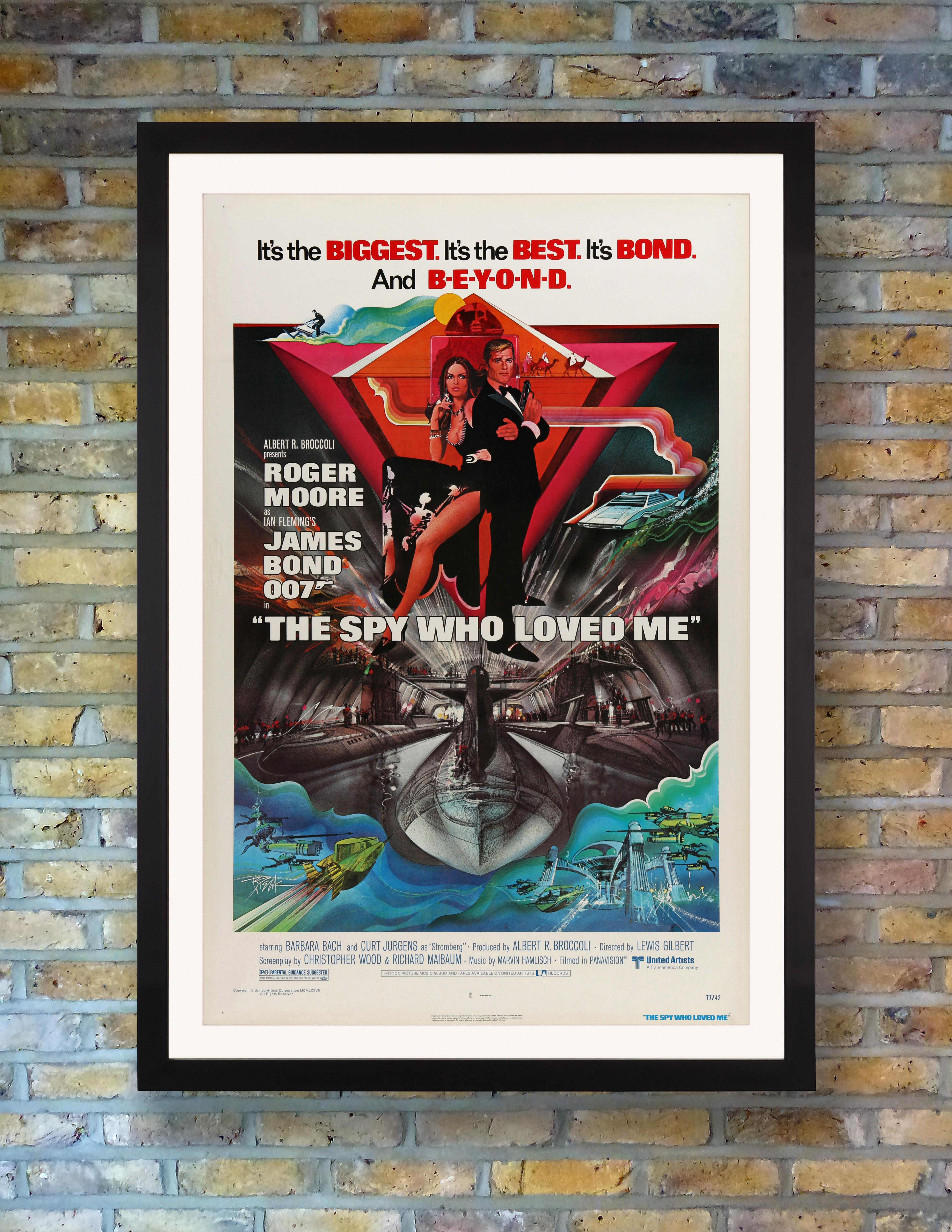 A dynamic US One Sheet poster for the 1977 blockbuster Bond classic 'The Spy Who Loved Me', designed by legendary poster artist Bob Peak. Considered Roger Moore's most memorable outing as 007, the tenth film in EON Productions' James Bond series was