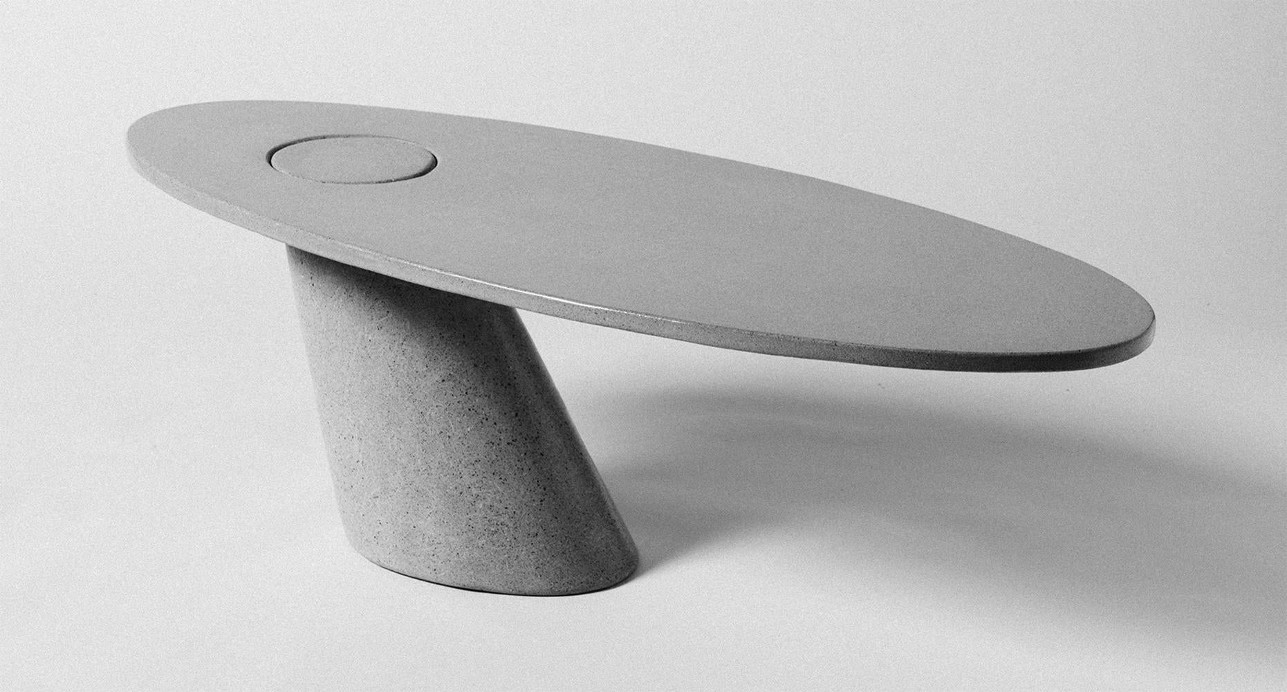 A play on balance, this table is constructed entirely of two concrete pieces. The tabletop is singly supported by the leg, while the two merge with gravity to lock into place. Their balance is a sight to behold.

Suitable for indoor and outdoor