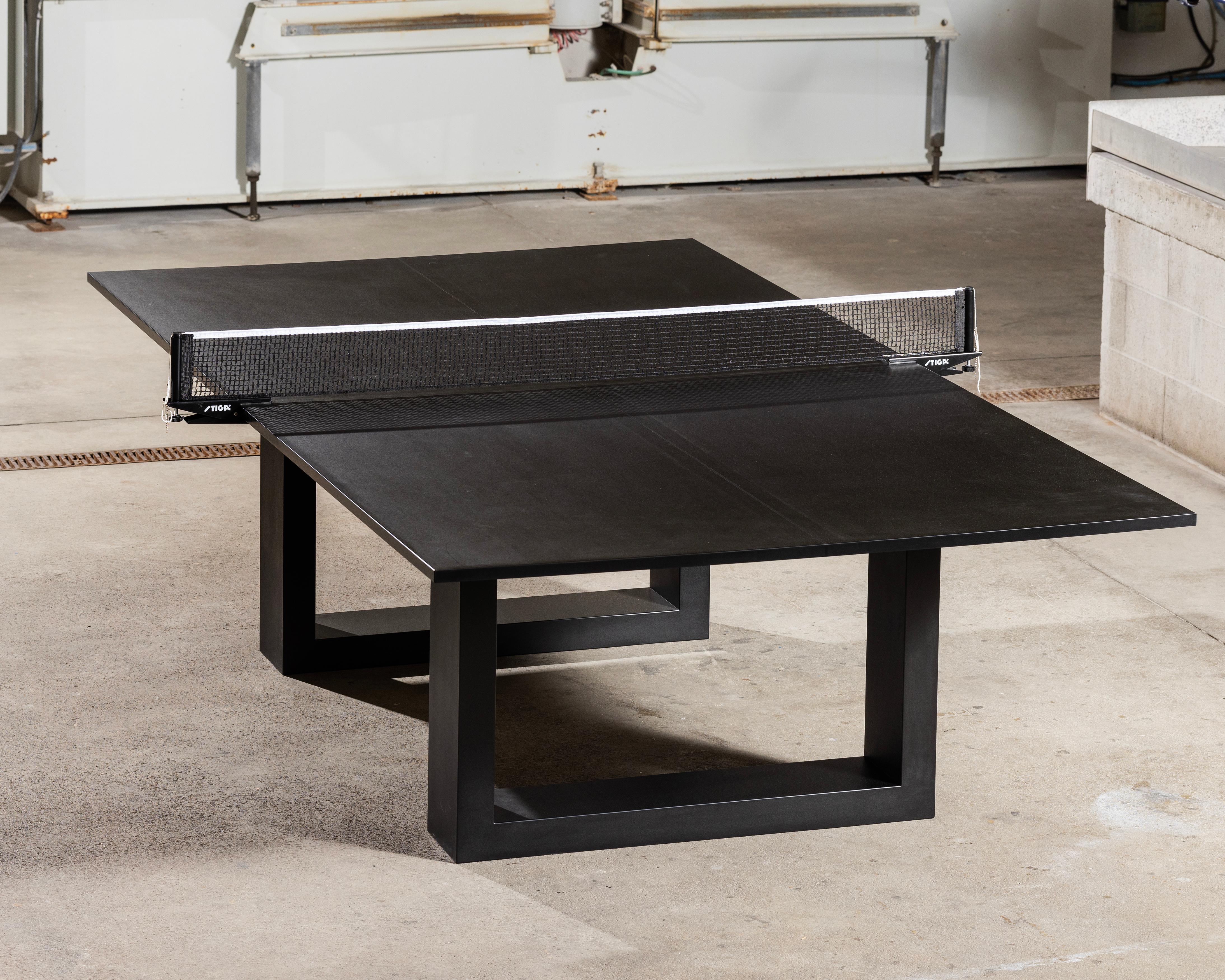 The classic James de Wulf Ping Pong Table, redesigned in a jet black finish.
The table is created entirely of post-consumer recycled paper and cardboard, treated in a petroleum-free, formaldehyde-free resin. The play surface is a flat matte black.