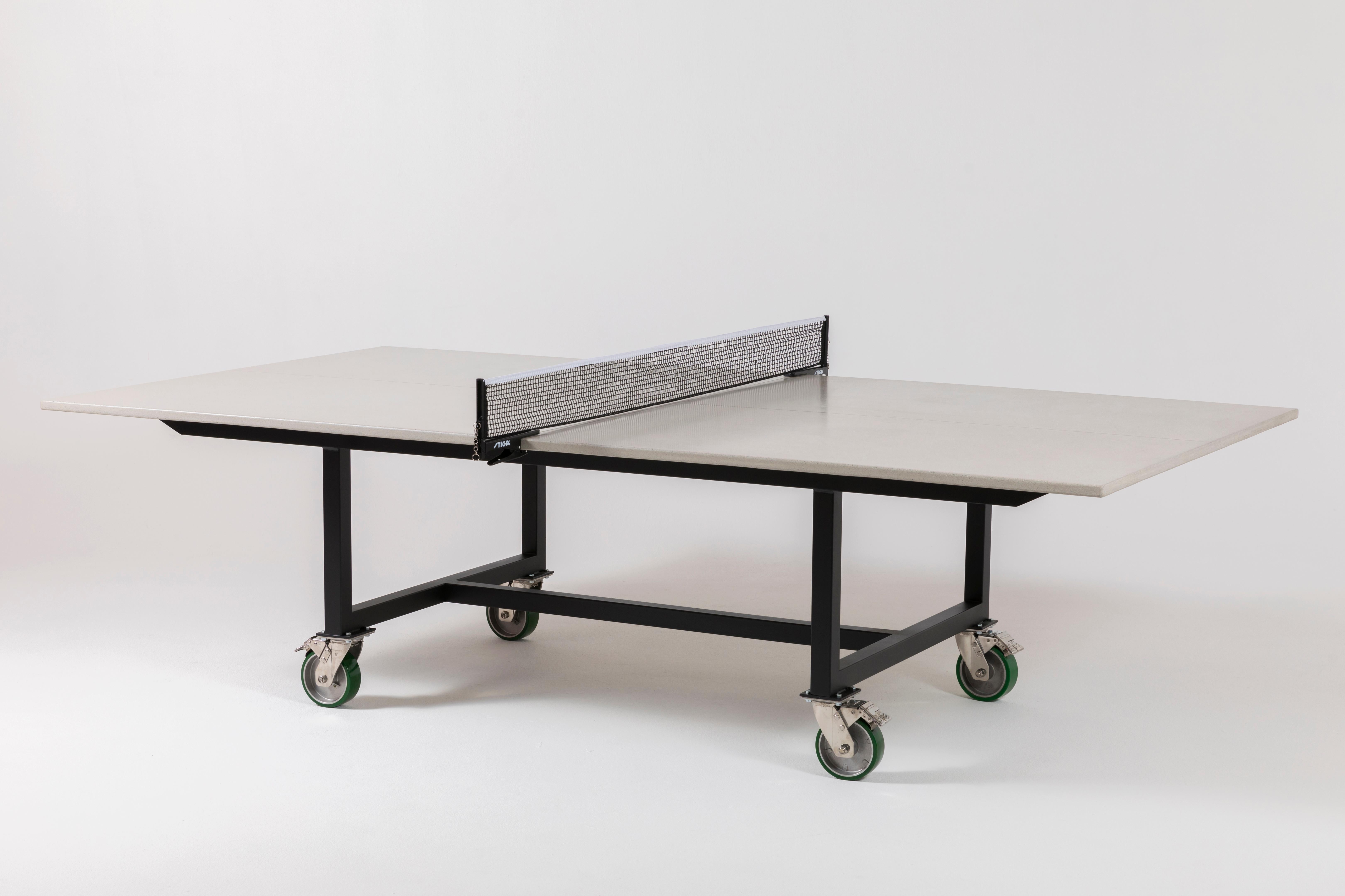 James de Wulf's latest Rolling Ping Pong table boasts a stylish game with a slick, finished concrete playing surface atop a powder coated steel base. The redesigned classic Vue table can move about your play room and outdoor setting on rugged 6
