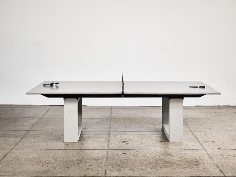 James de Wulf custom contemporary concrete Ping-Pong Table. 
Regulation sized with acid stained center line and carbon fiber reinforcement. 
Add seating to welcome guests as a dining table.

Tables are sealed with a unique finishing wax and will