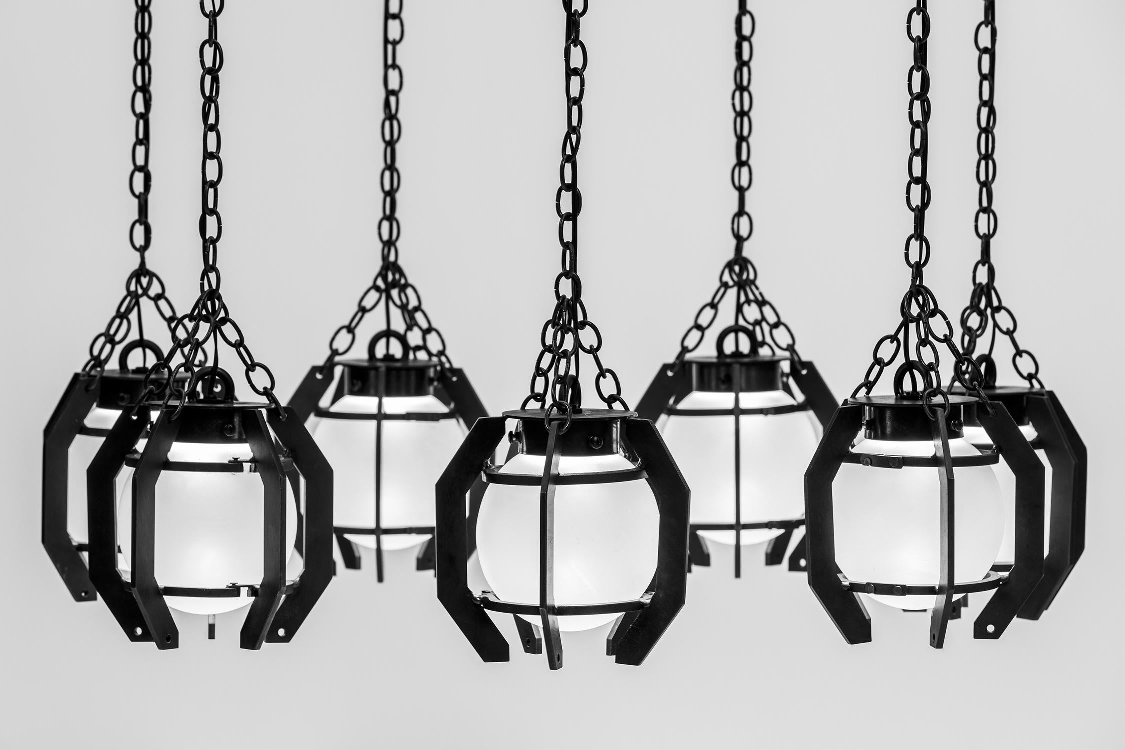 Grand industrial chandelier created of forge-burnt black steel. Each 10
