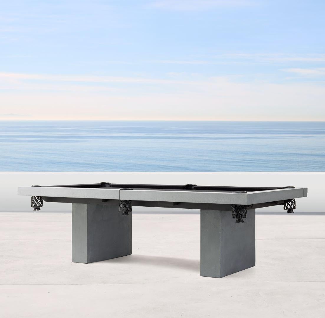 A special re-edition of the Classic James de Wulf pool table, this one features a pair of solid concrete legs with a raw edge detail. The cast-concrete tabletop has a smooth, high-performance finished surface, layered in premium black felt.