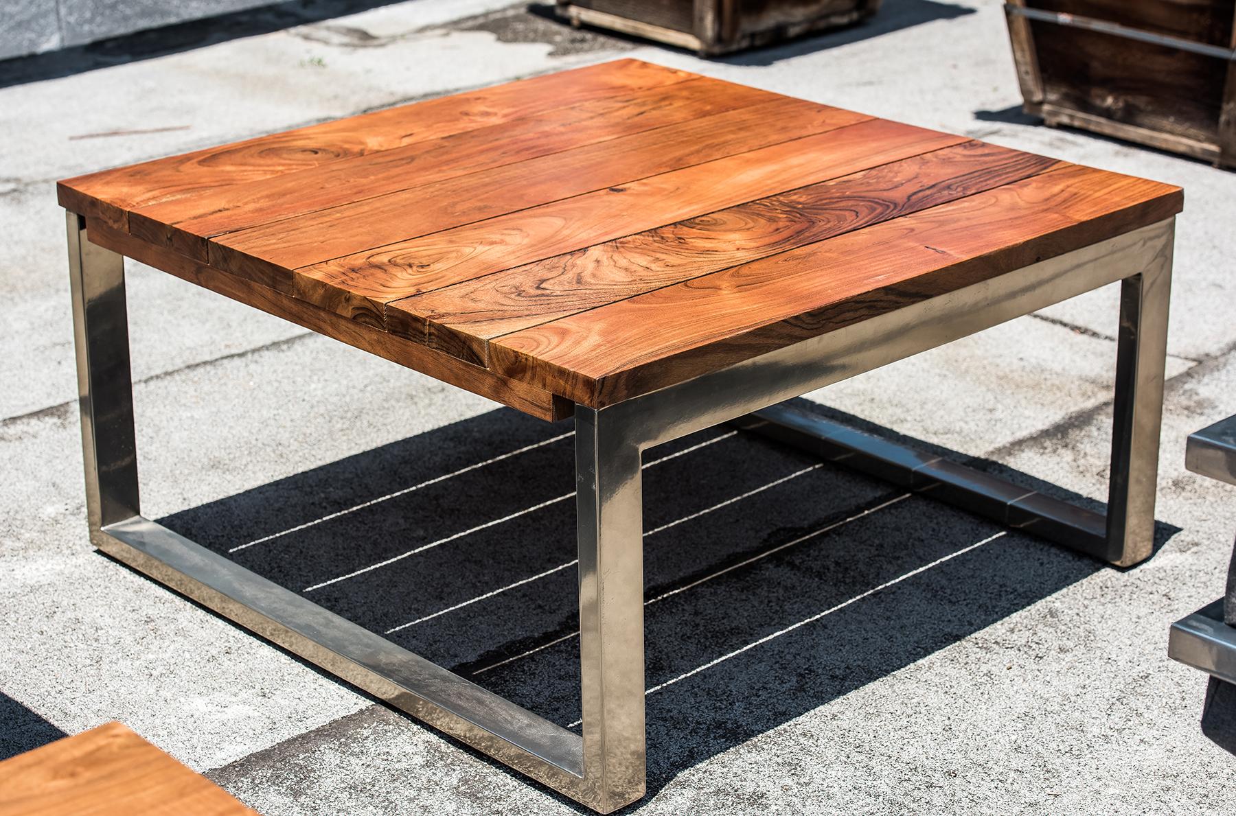 A living area table of Ipe wood, decorated by a stainless steel base. Holding true to the form of James de Wulf, this 30