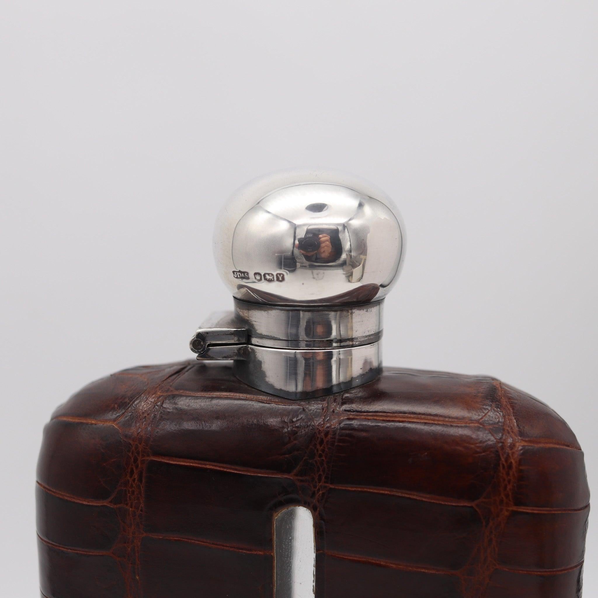 Liquor flask bottle designed by James Dixon & Sons.

Very handsome and handy antique liquor flask bottle, created in Sheffield England at the silversmith workshop of James Dixon & Sons, back in the 1891. This beautiful large liquor flask has been