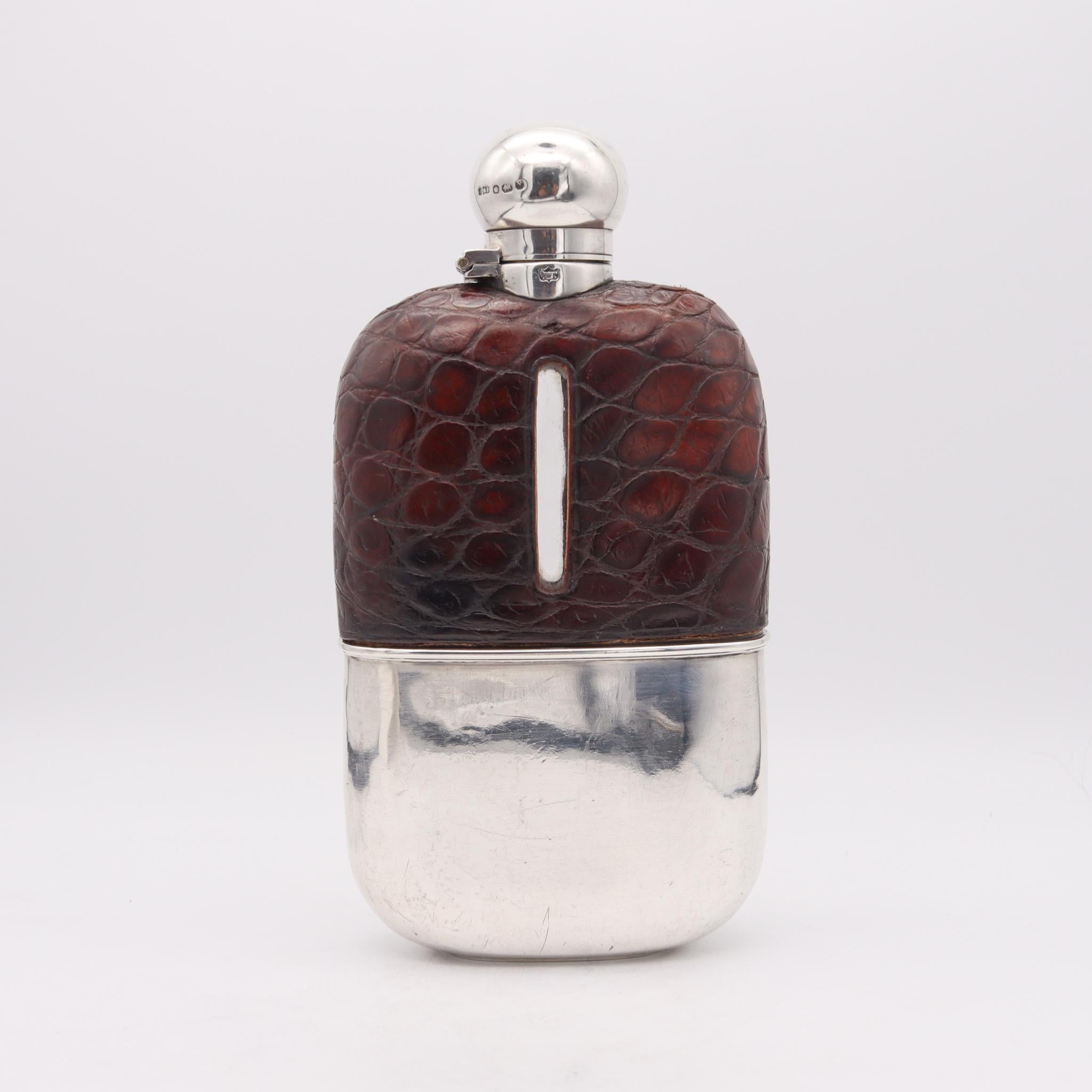 Liquor flask bottle designed by James Dixon & Sons.

Very handsome and handy liquor flask bottle, created in Sheffield England by the silversmith James Dixon & Sons, back in the 1891. This beautiful large liquor flask has been crafted in solid
