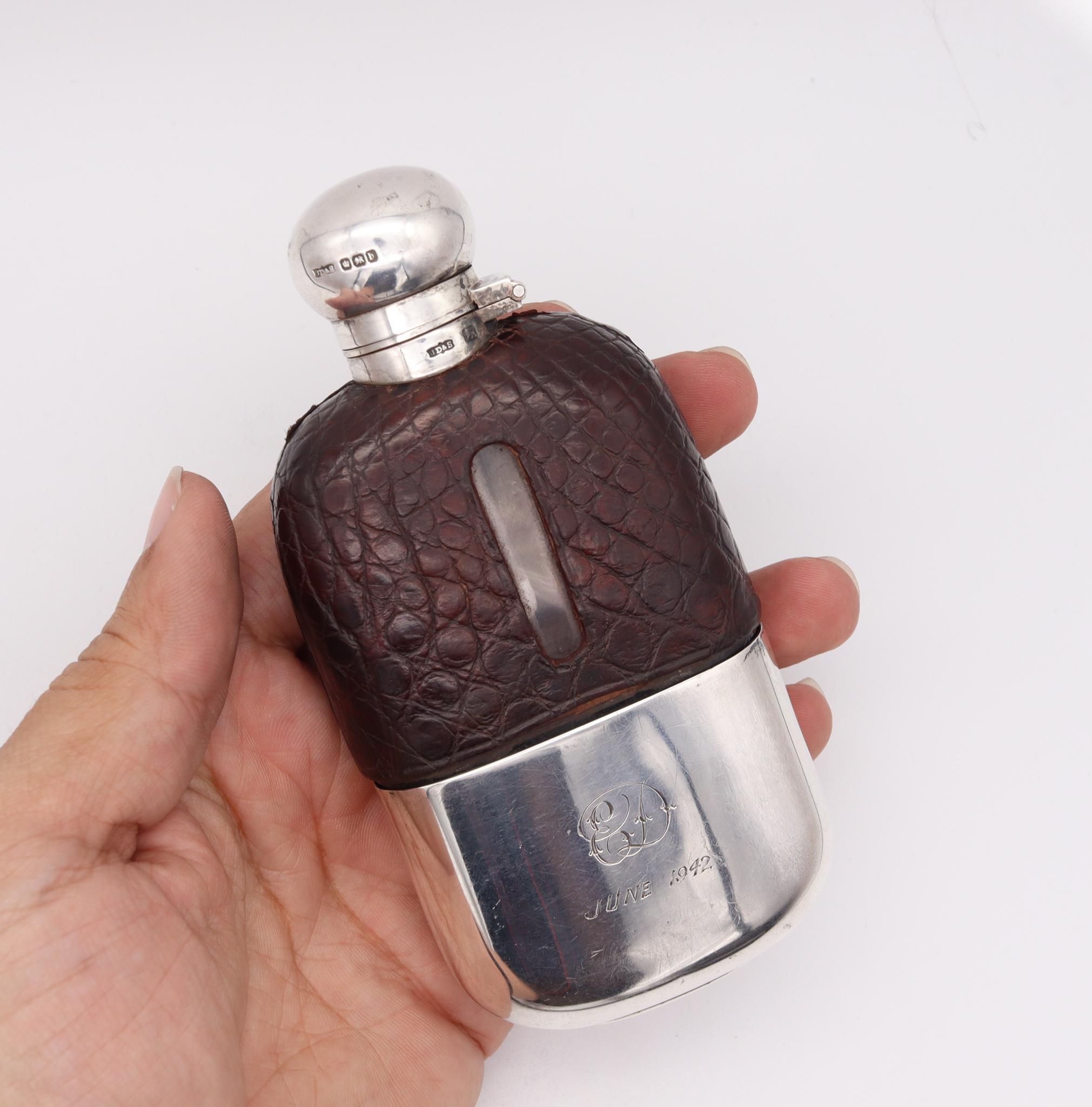 Liquor flask bottle designed by James Dixon & Sons.

Very handsome and handy liquor flask bottle, created in Sheffield England by the silversmith James Dixon & Sons, back in the 1894. This beautiful liquor flask has been crafted in solid sterling