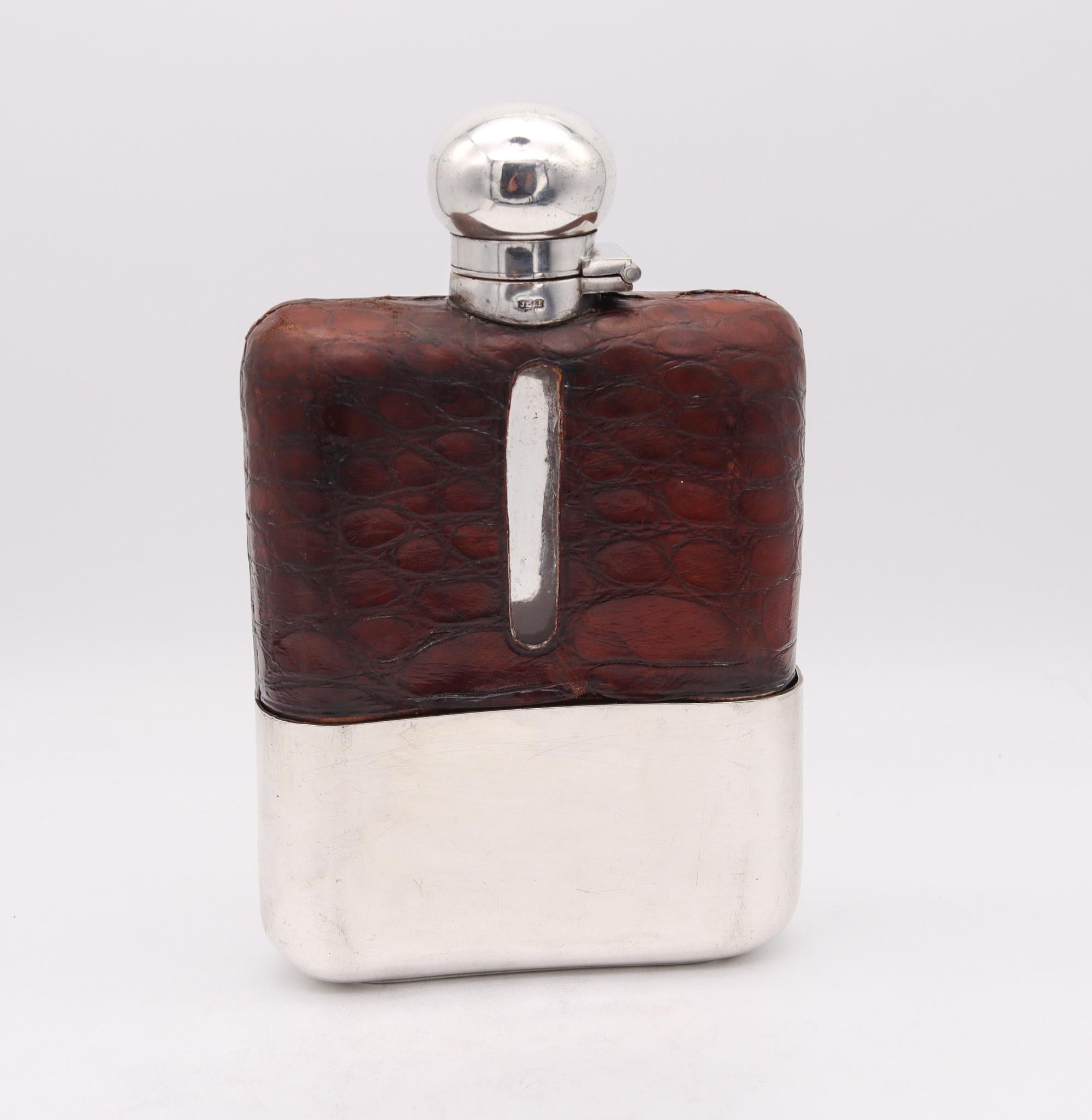 Liquor flask bottle designed by James Dixon & Sons.

Very handsome and handy liquor flask bottle, created in Sheffield England by the silversmith James Dixon & Sons, back in the 1900. This beautiful large liquor flask has been crafted in solid