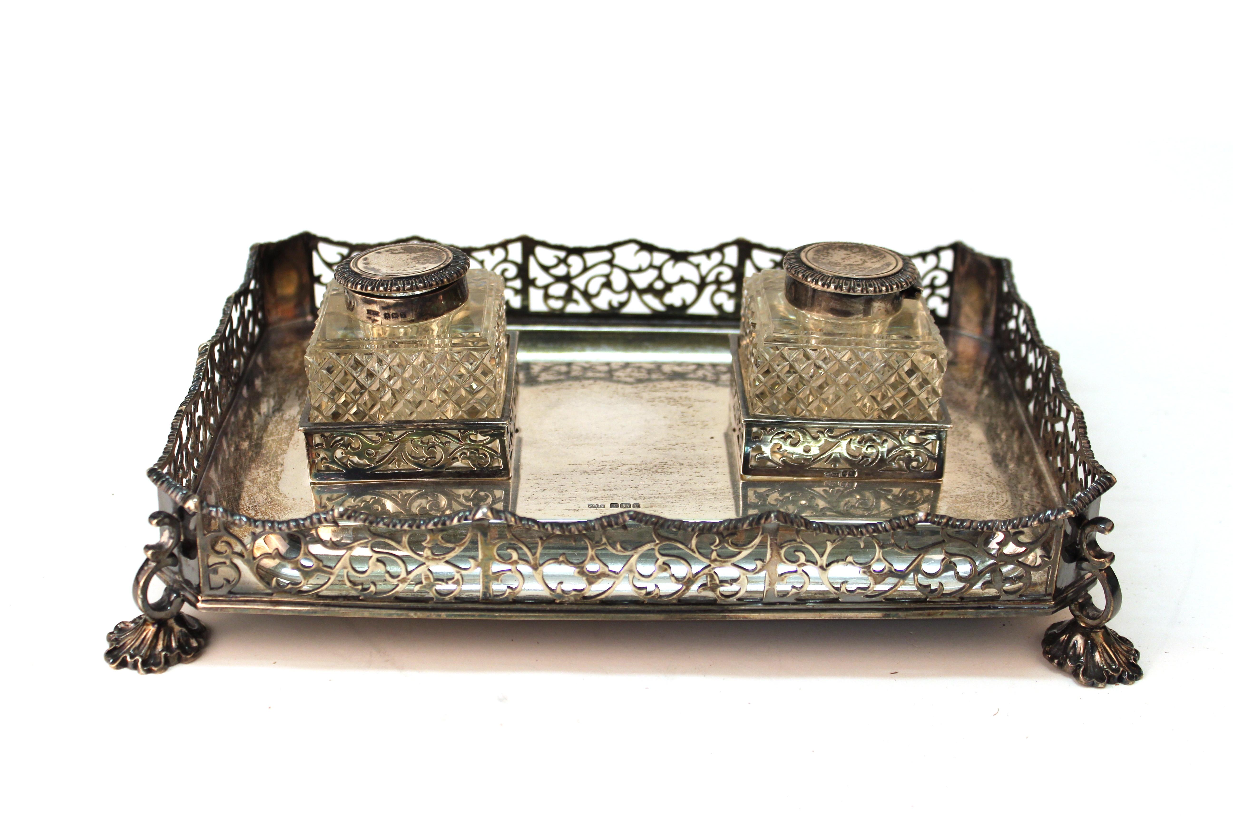 James Dixon & Sons English sterling silver ink wells on tray with pierced gallery. James Dixon & Sons, Sheffield hallmark on inkwell stand. Two fitted cut-crystal diamond pattern ink jars with sterling silver lids., marked. Interior galleries