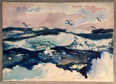 Gulls volant sur le surf