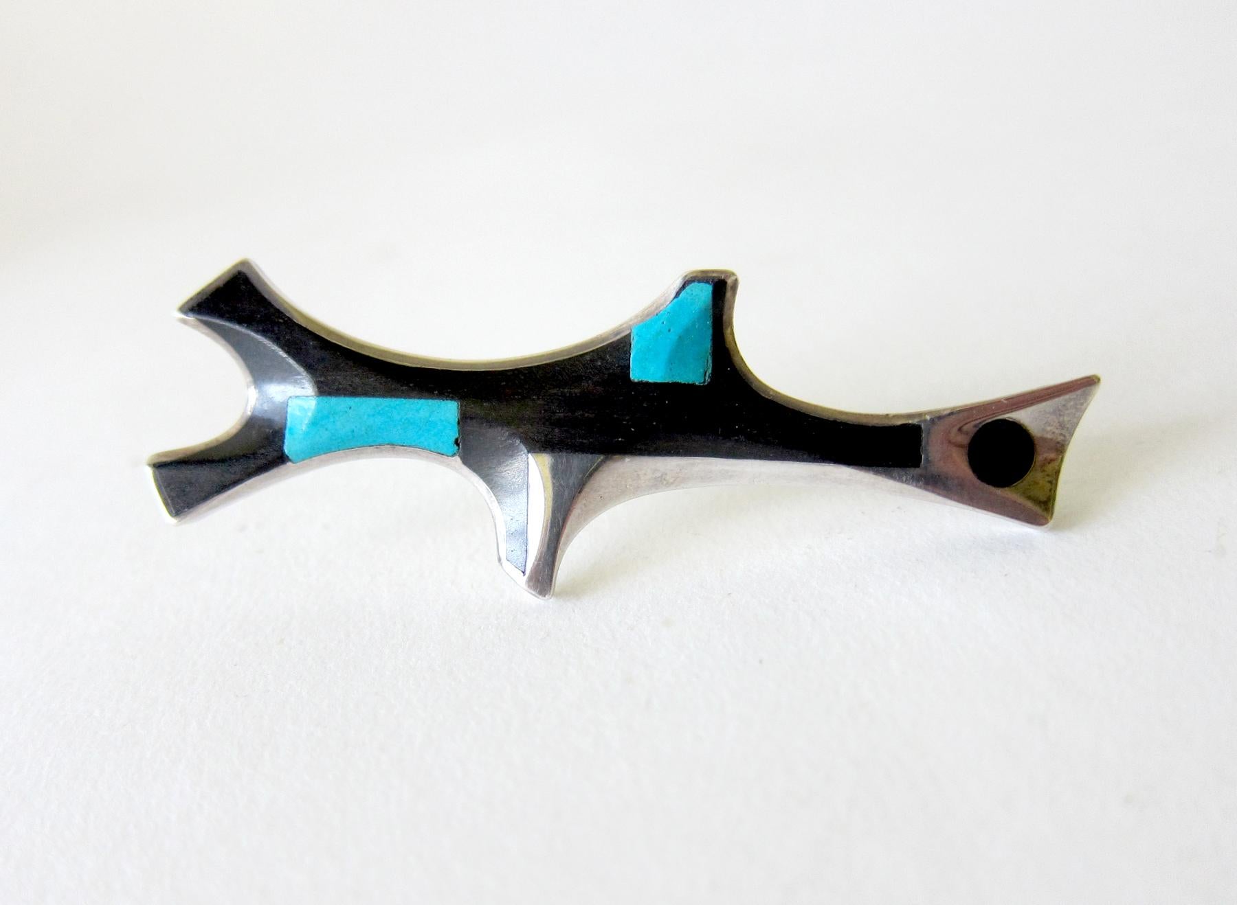 Sterling silver brooch with inlay of turquoise and wood created by James Frappe of Pittsburgh, Pennsylvania.  Brooch measures 2 7/8