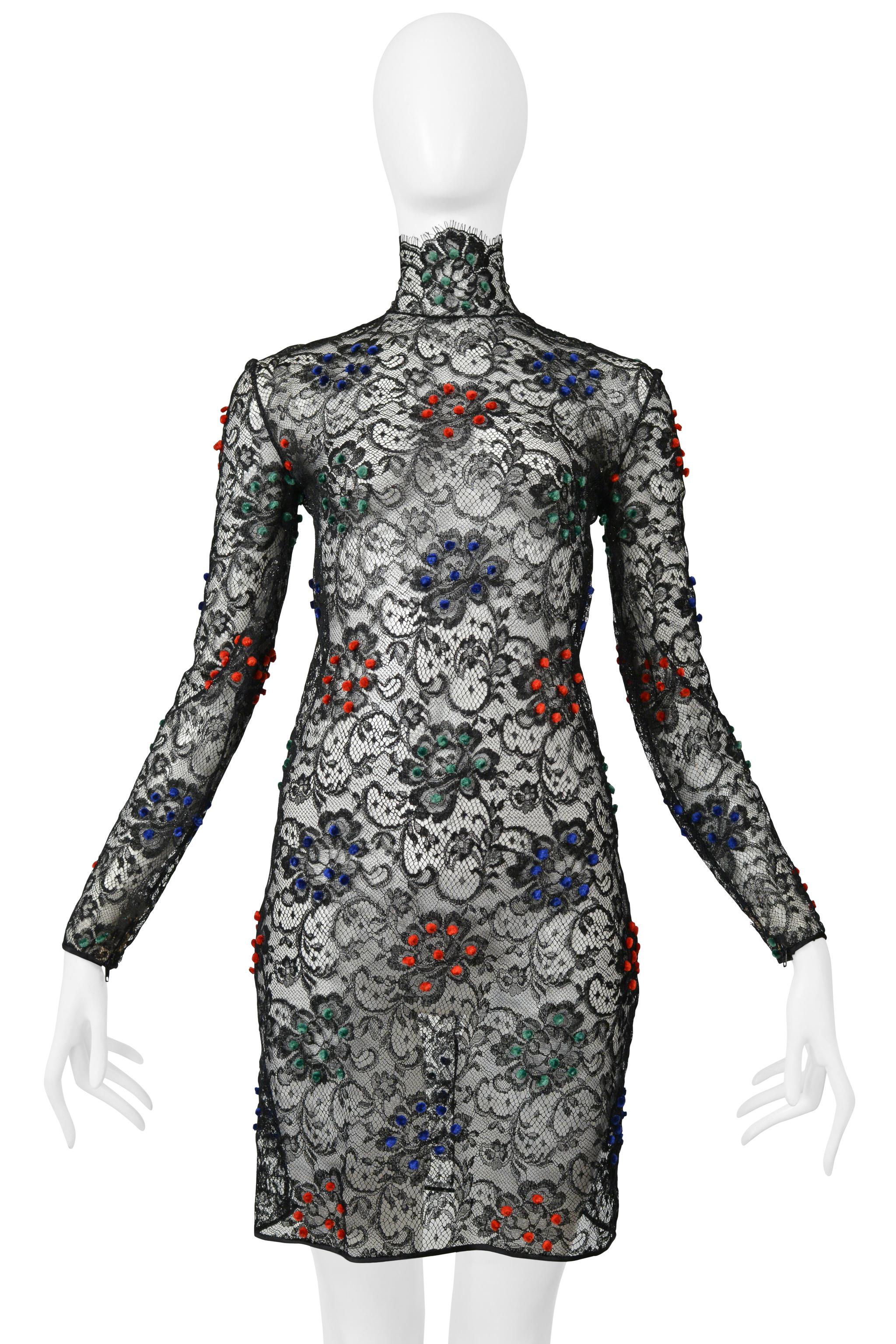 Resurrection is excited to present a vintage Galanos fancy black lace cocktail dress featuring a fitted body, multicolor velvet pom-poms, zippers at cuffs, fancy satin trim hem, and a blue center back zipper. 

Galanos
Designed James Galanos
Size: