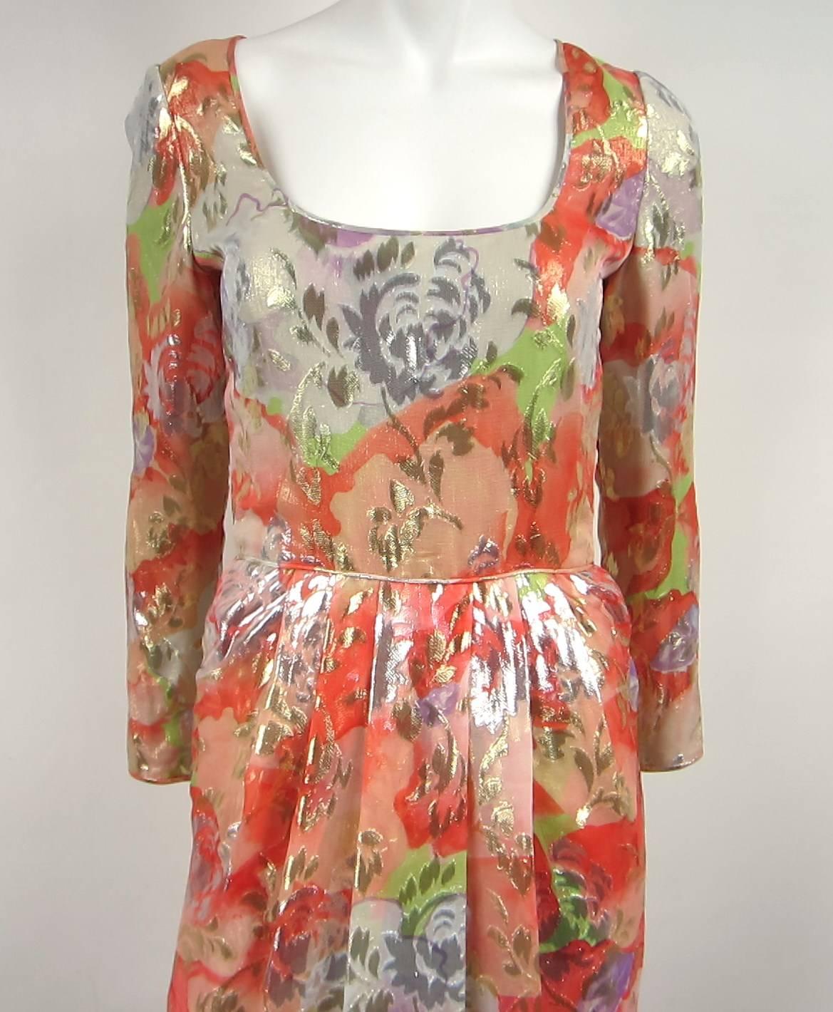 Stunning colors on this Galanos Dress. Featuring a Zippered Back, Zippered Sleeve and Plunging squared neckline. Measures- Bust 36 inches --Waist 25 inches-- Hips 35 inches --Length 40.5  inches shoulder to hem. A stunning piece for a day or night
