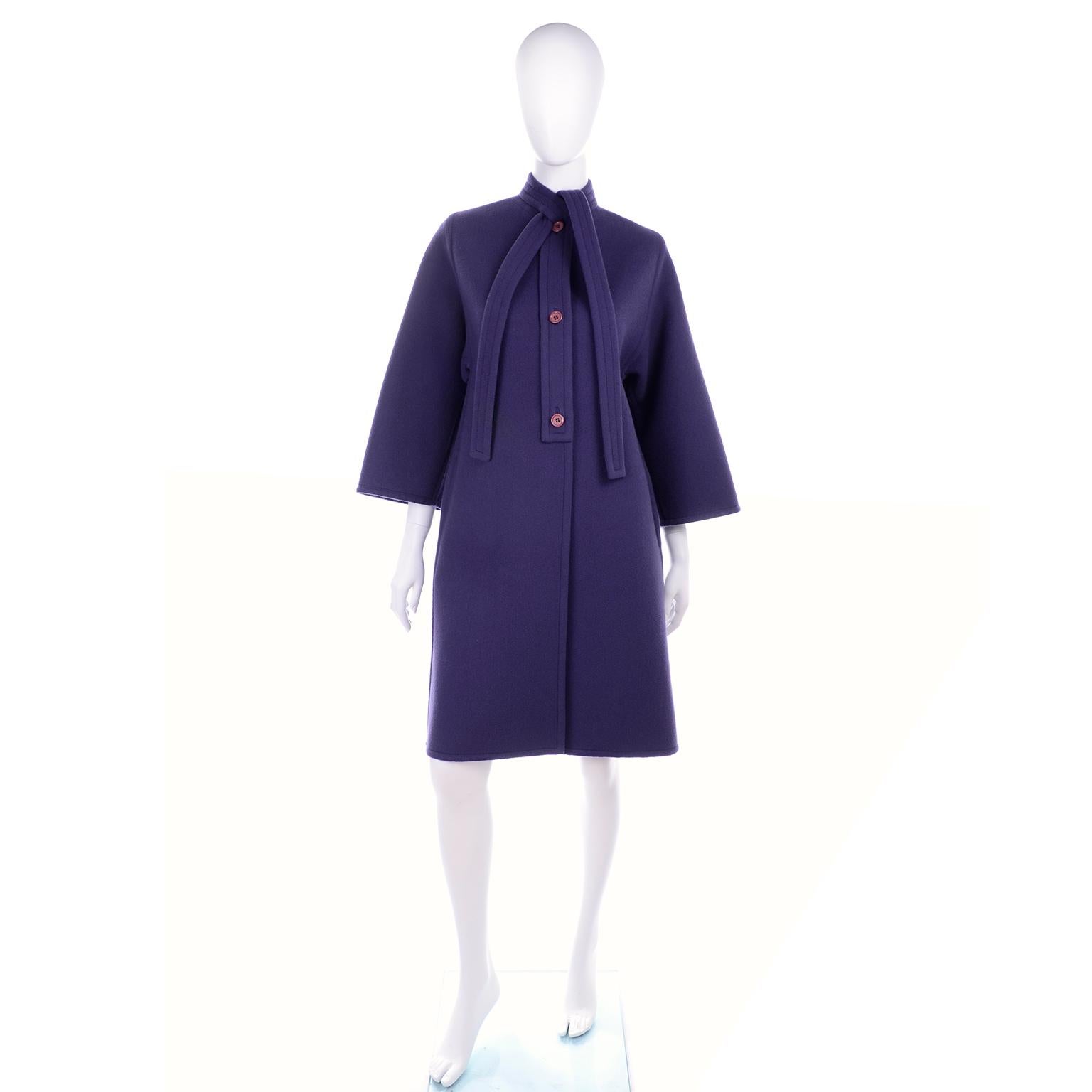 This is a beautiful vintage Galanos cool tone purple wool coat. This great coat has front pockets, a tie at the neck, and it closes with 3 front buttons. We love the wide sleeves and the big center pleat in the back. Galanos pieces are always