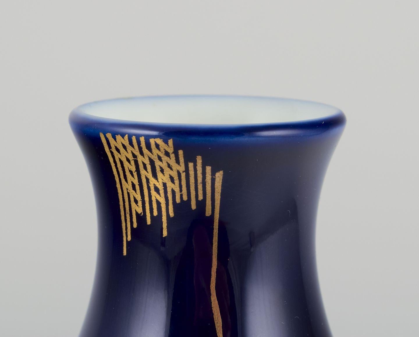 Pre-owned goods are exempt from import duties for U.S. customers. 
Therefore, no import tariffs will be applicable to your purchase.

James Guitet (1925–2010) for Sèvres.
Large porcelain vase. Hand-decorated with gilded motifs.
Classic butt-shaped