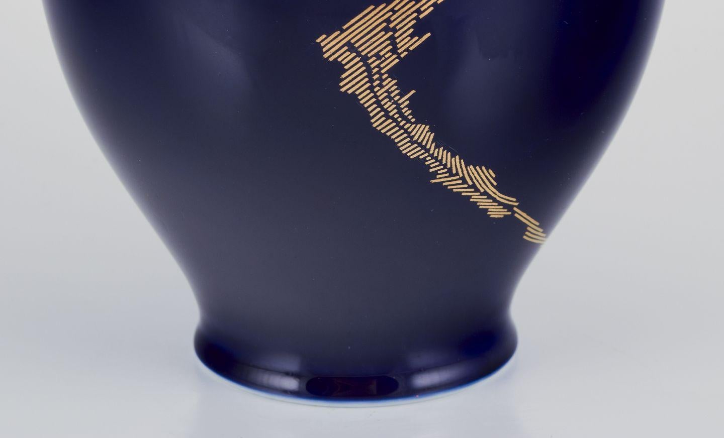 Gilt James Guitet for Sèvres. Large porcelain vase with Sèvres blue glaze. For Sale