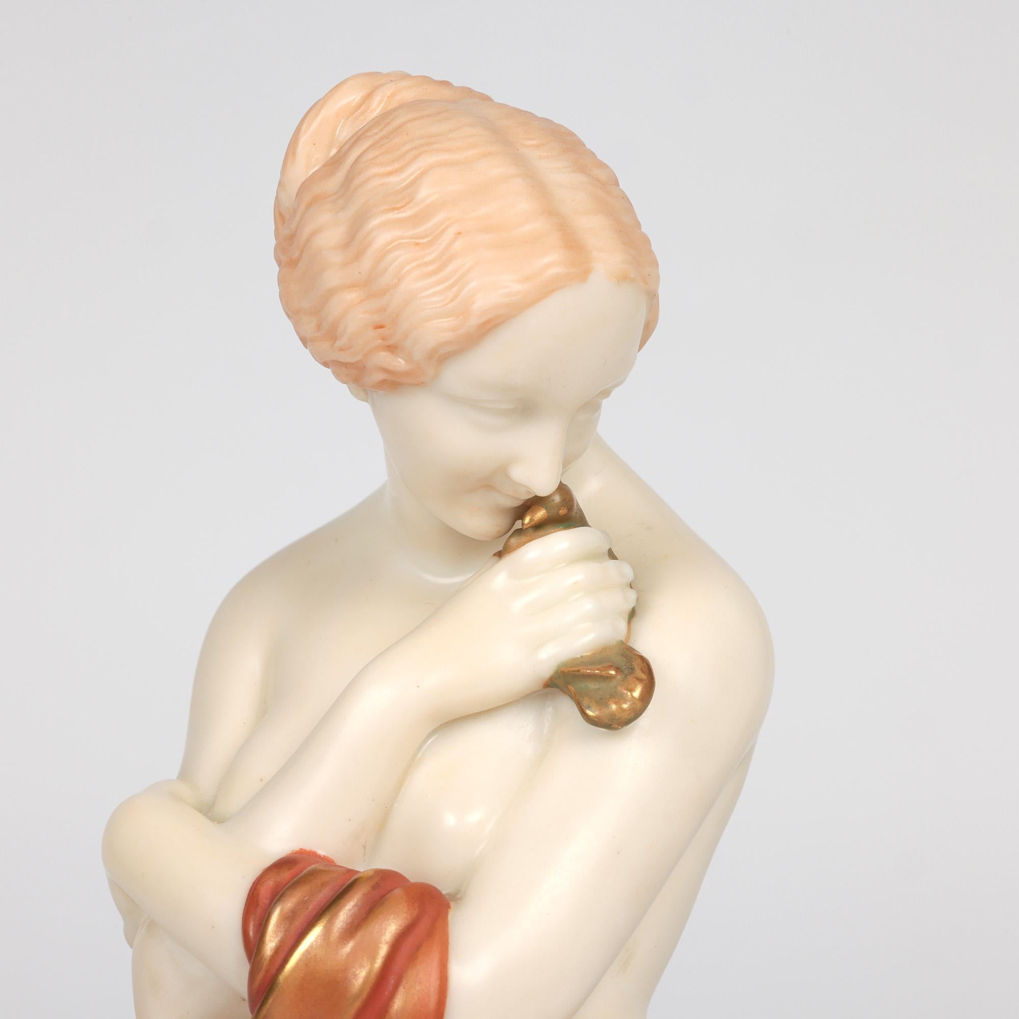 An exceptional pair English aesthetic movement porcelain pair of figurines portraying Joy and Sorrow by renowned potter and artist James Hadley (British, 1837-1903) dated 1896. The figurines stand raised on circular bases and portray young ladies