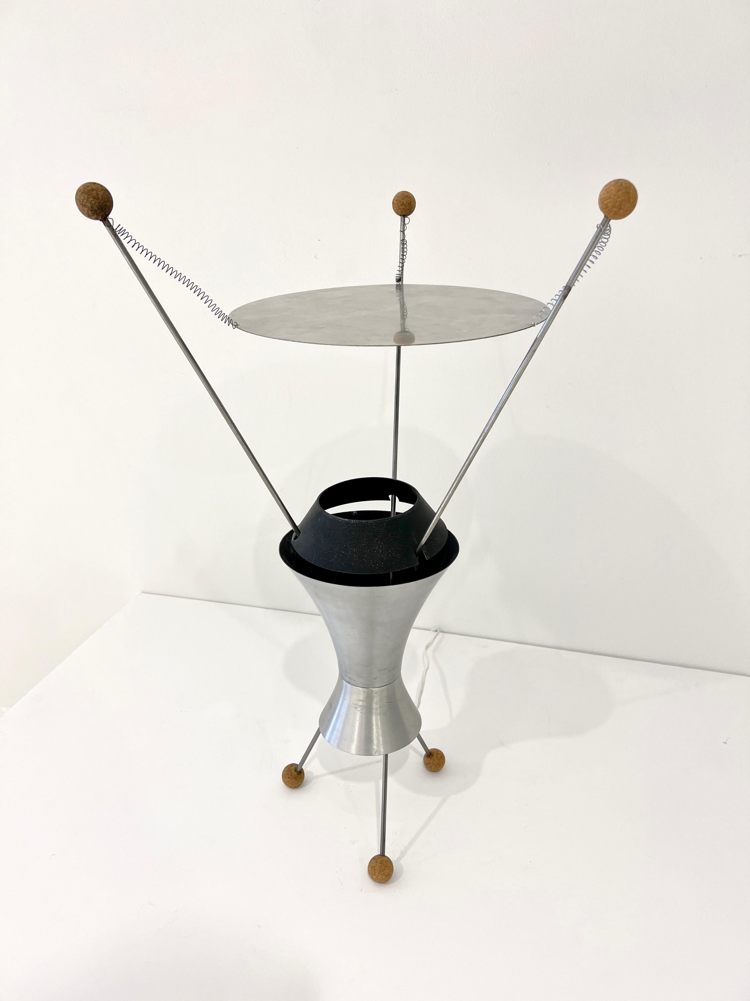 Table Lamp, model T-3-C, in spun aluminum, enameled metal, steel, cork.  Designed by James Harvey Crate, USA, 1950.
The T-3-C lamp received Third Prize in MoMA’s Low-Cost Lighting Competition of 1951 and was shown in the New Lamps exhibition at the