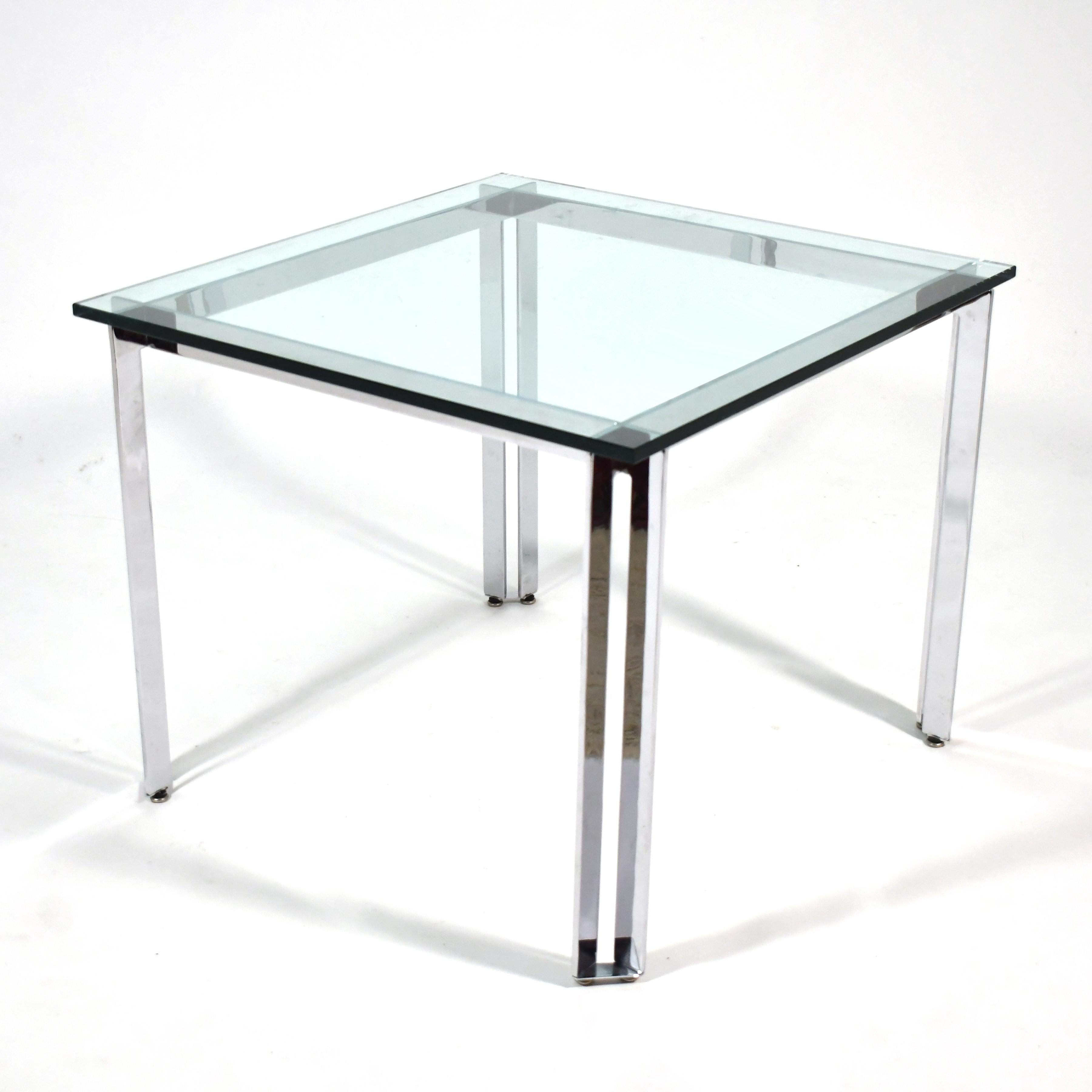 This sophisticated table by James Howell for Tri-Mark has a chrome steel base that reminds us of Poul Kjaerholm's refined designs. Particularly pleasing is the detail of the cross-lap at the corners.

The table is perfectly scaled for use as a