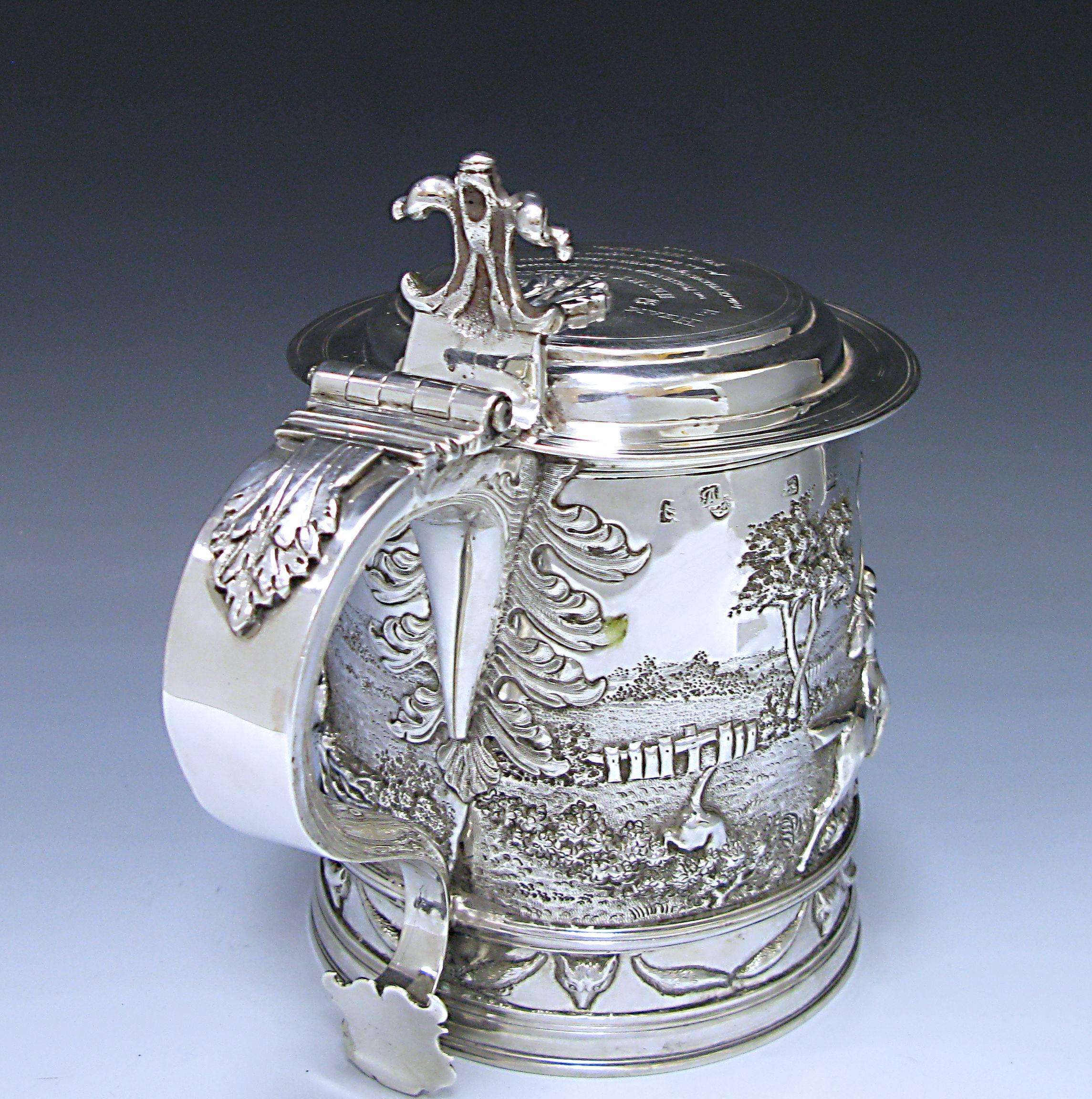 A magnificent James II antique silver lidded Tankard made in 1687. The makers mark is that of I A Monogram of London (see Jacksons page 135). The tankard was later chased in 1842 when it presented to Henry Garlick, by the gentlemen of the Duke of