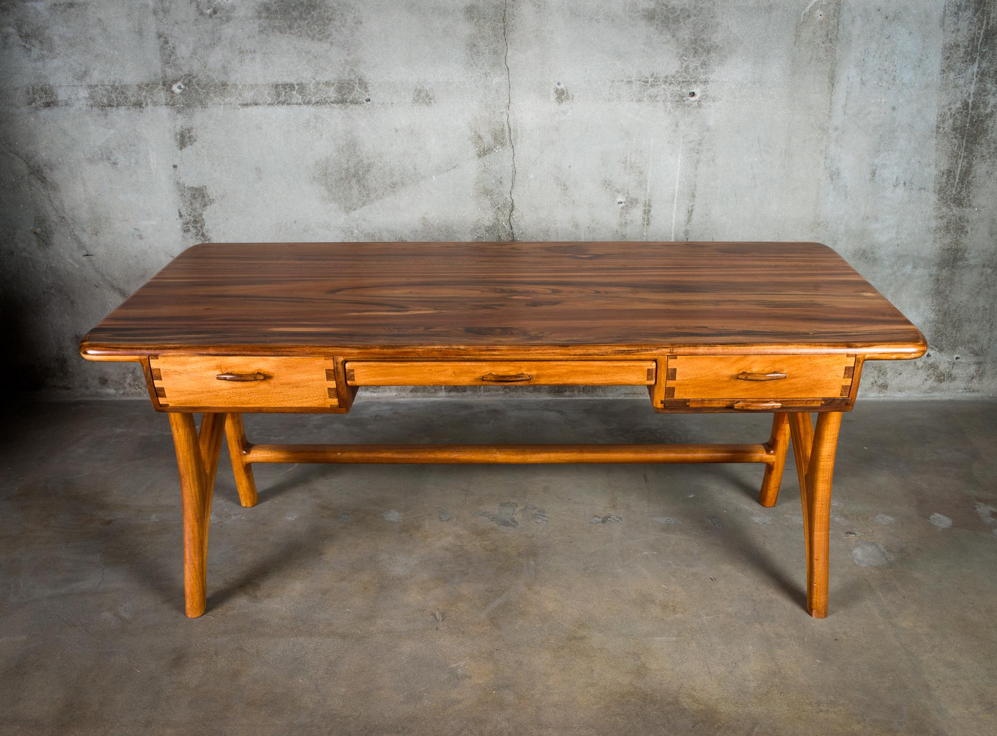 One desk by James Sweeney in rosewood.