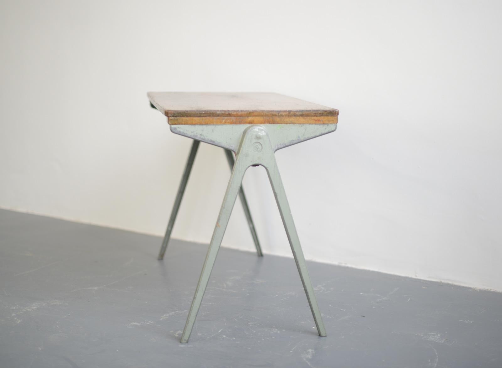 James Leonard compass table circa 1940s

- Cast Aluminium frame with compass shaped legs
- Original green paint
- Beech top
- Stamped ESA
- Made by Esavian
- First generation model
- English ~ 1940s
- 91cm long x 42cm deep x 57cm