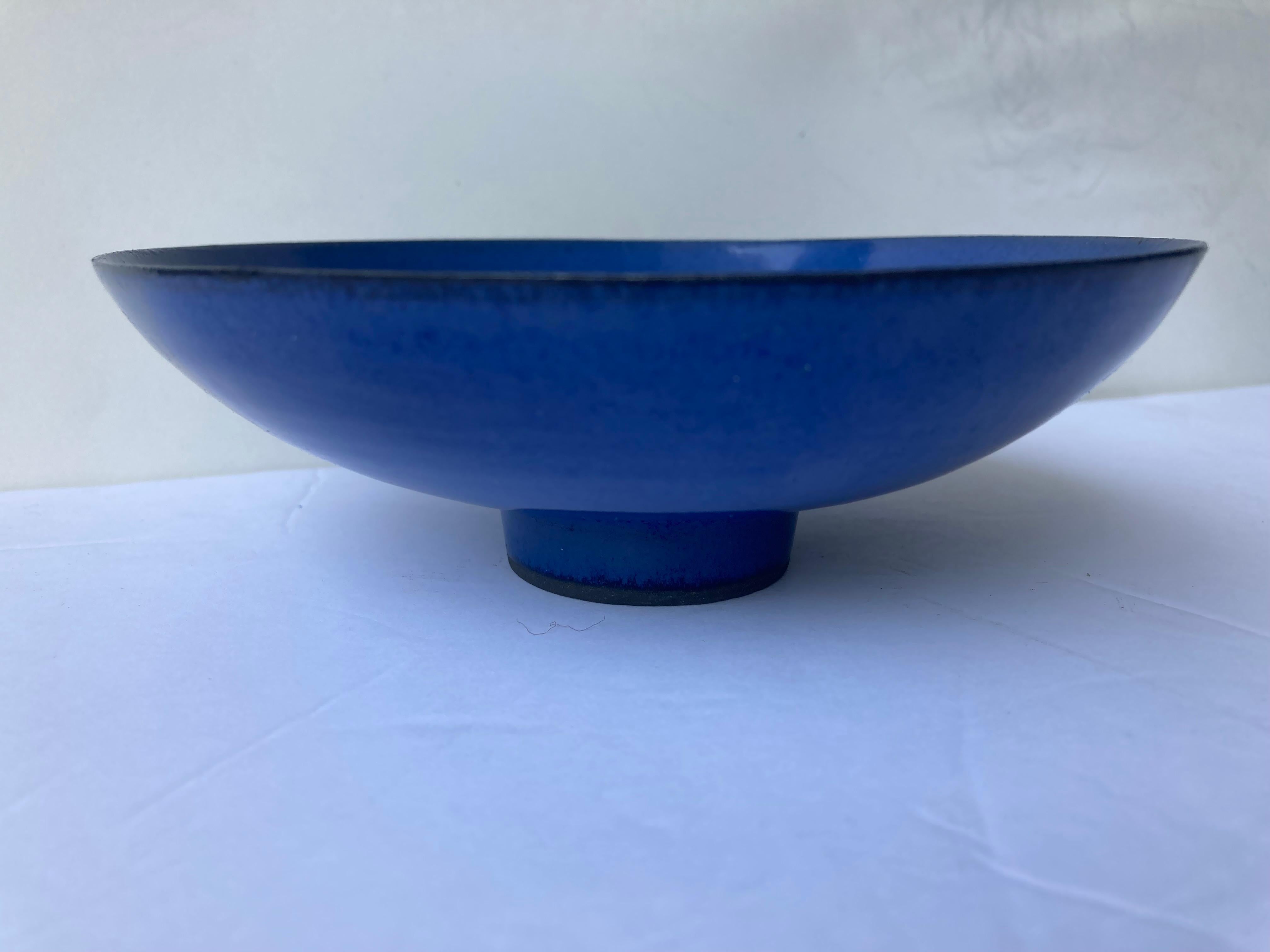 Very thin porcelain footed bowl, by the well known artist James Lovera.