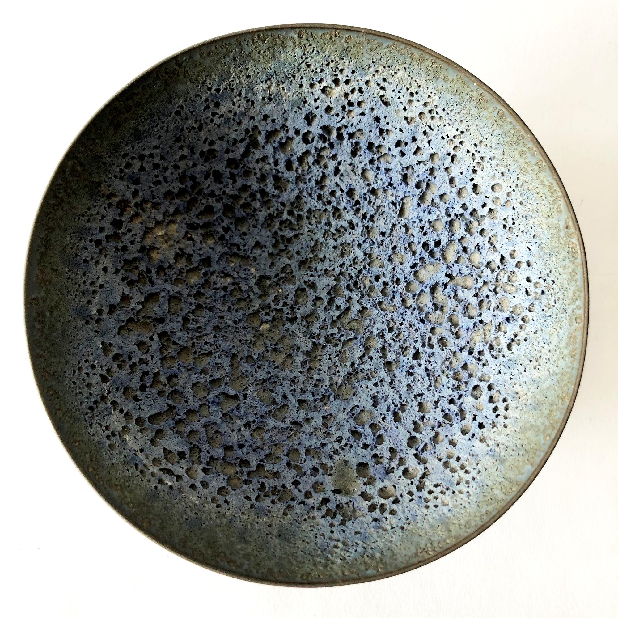 Paper thin porcelain bowl with lava glaze created by James Lovera of Hayward, California. Bowl measures 3