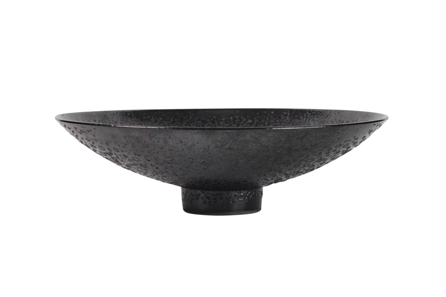 James Lovera massive footed bowl in a black iridescent glaze, measures 18 inches wide.