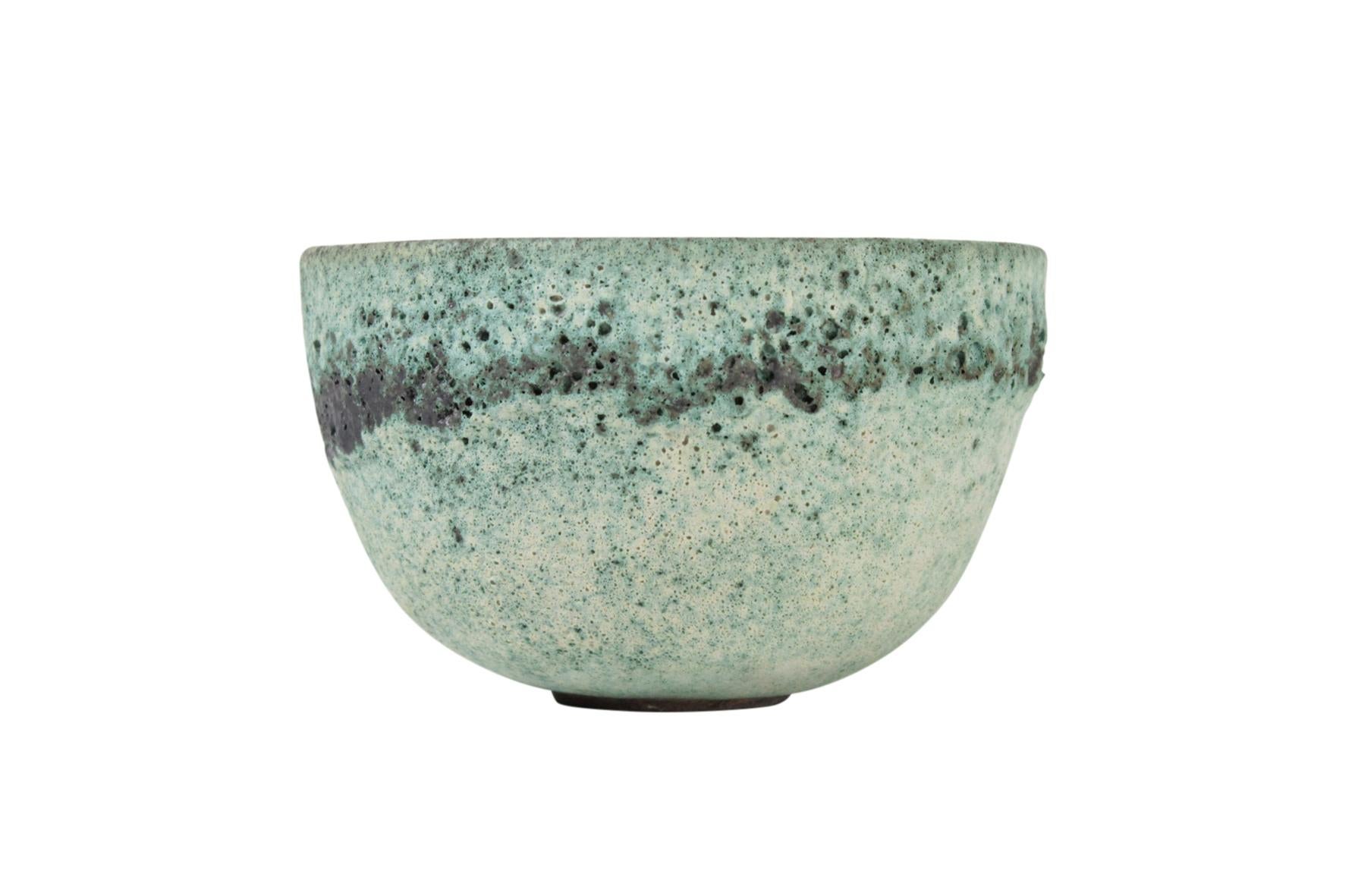 James Lovera Studio pottery bowl in a green crater glaze. Signed.