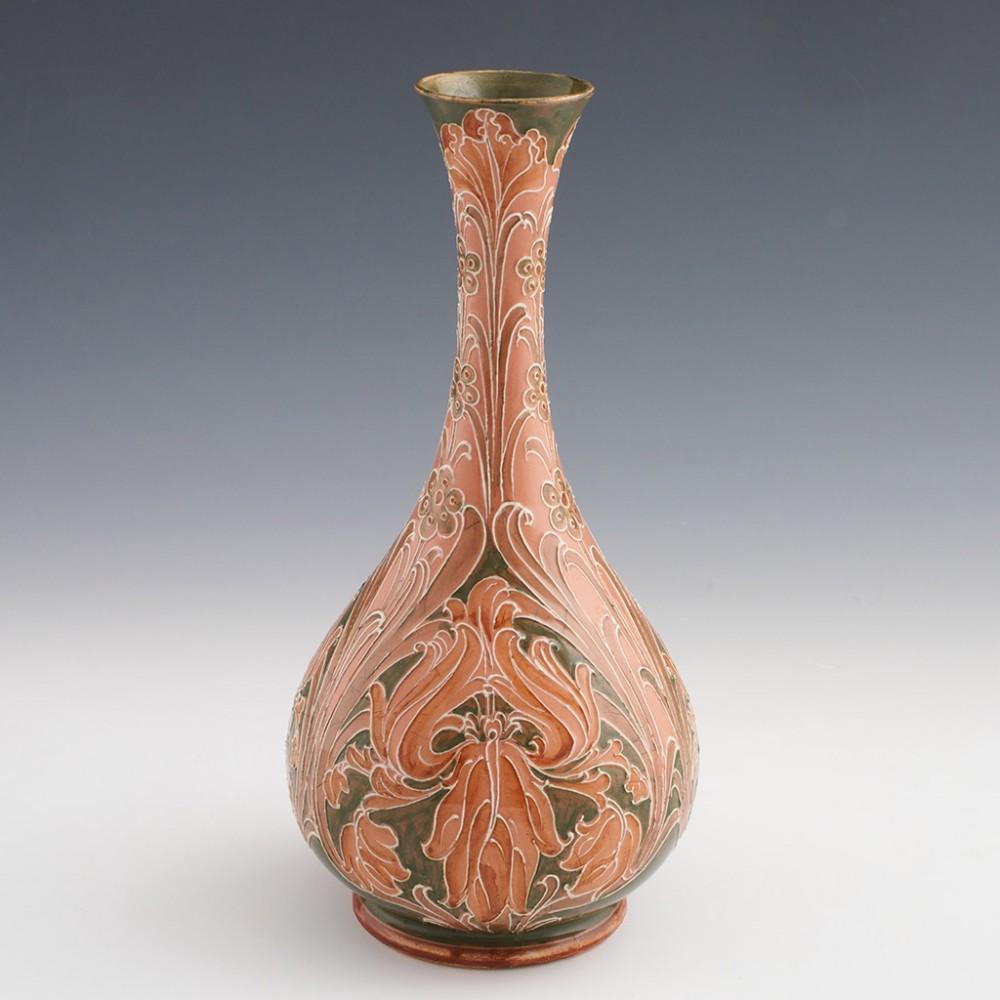 Heading : William Moorcroft Florian ware vase
Date : c1900
Origin : Burslem, Staffordshire, England
Bowl Features : Baluster form decorated in green and slamon pink in the iris pattern.
Marks : Florian Ware JAS Macintyre mark to base along with WM