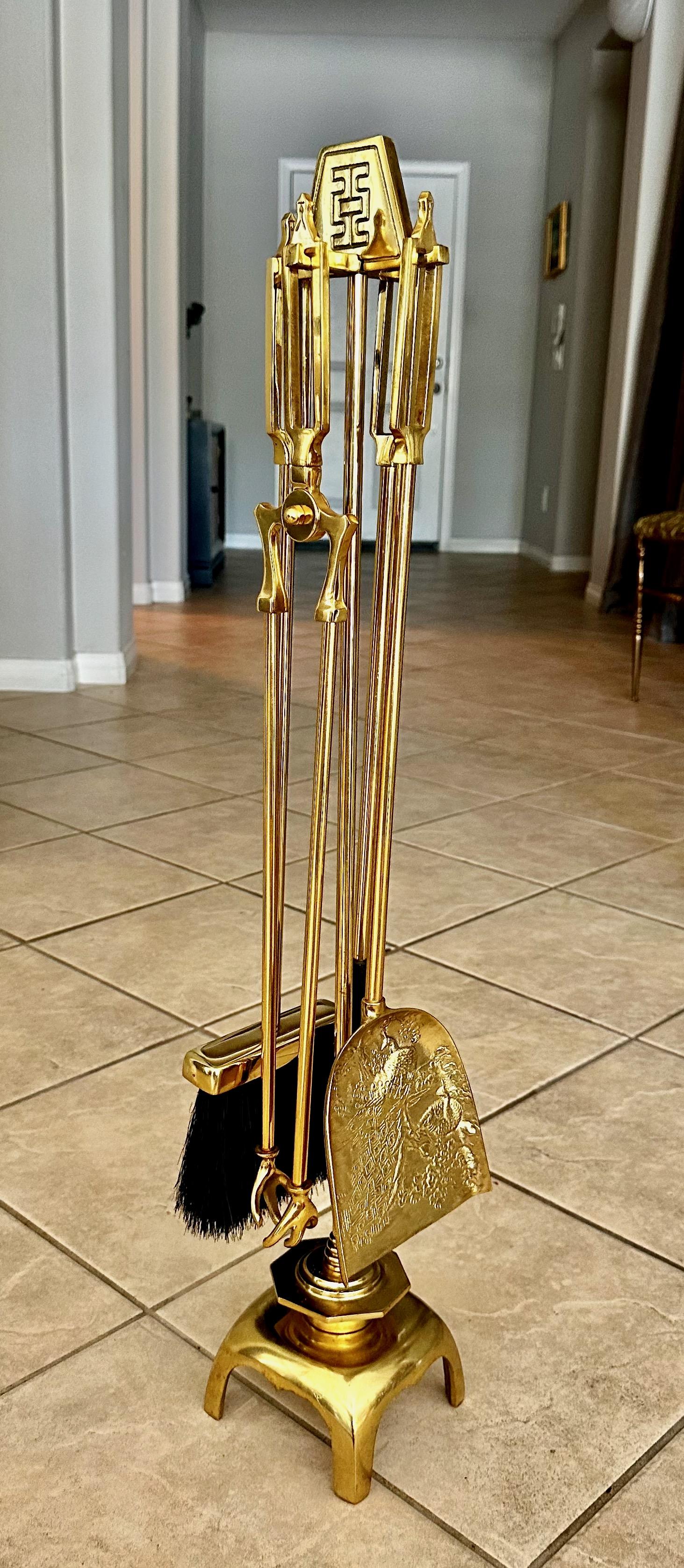 Mid century James Mont style Asian inspired motif 5-piece fireplace tool set. Heavy high quality cast brass with intricate detail design on shovel. Included are the stand, the poker, shovel, broom and tongs. The stand measures approximately 31