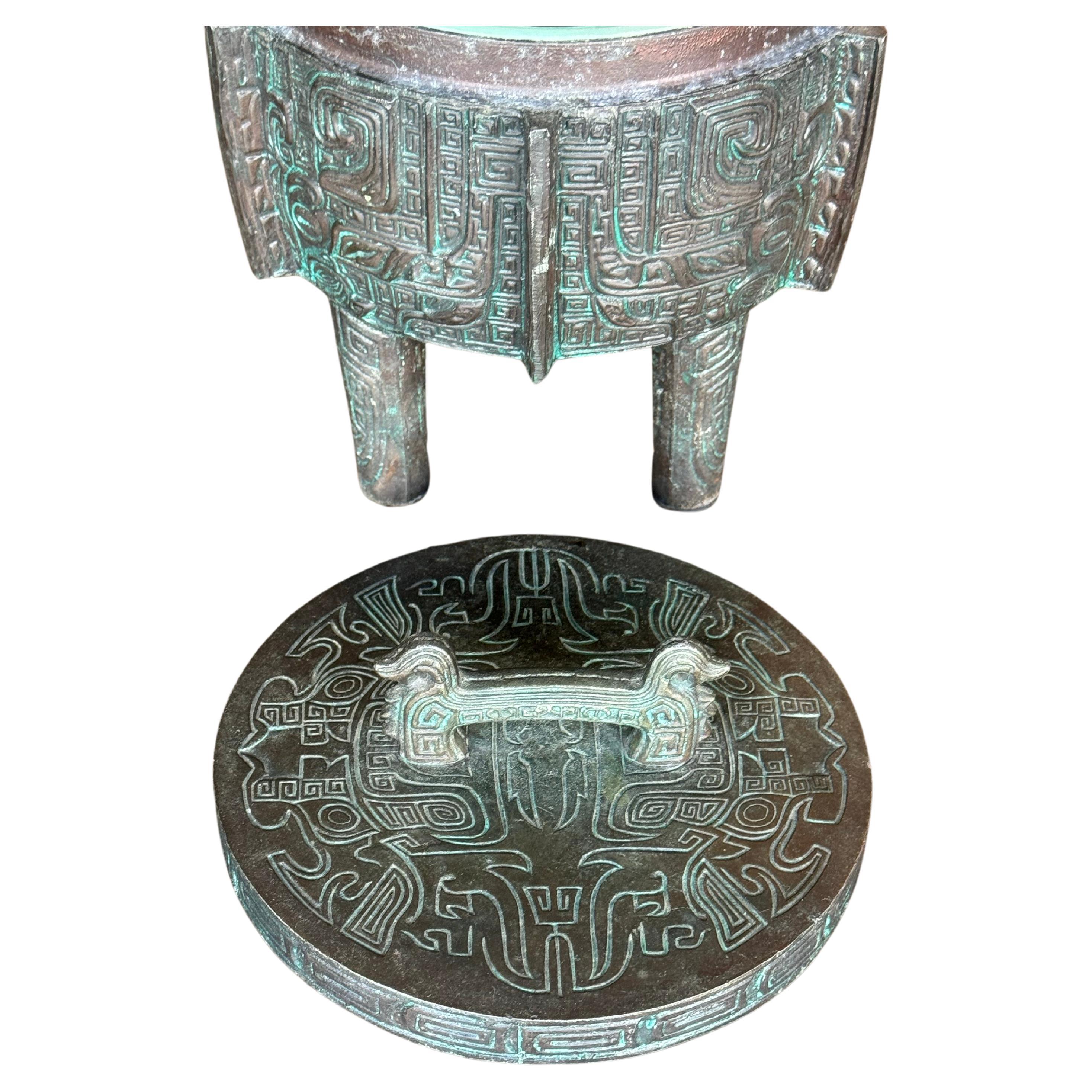 Great ice bucket in the manner of James Mont, circa 1960s. Has a Chinese/Asian design with a verdigris finish. Ice bucket is in excellent shape with very light use over the years. Made of metal with a bronze patina finish. Great painted green