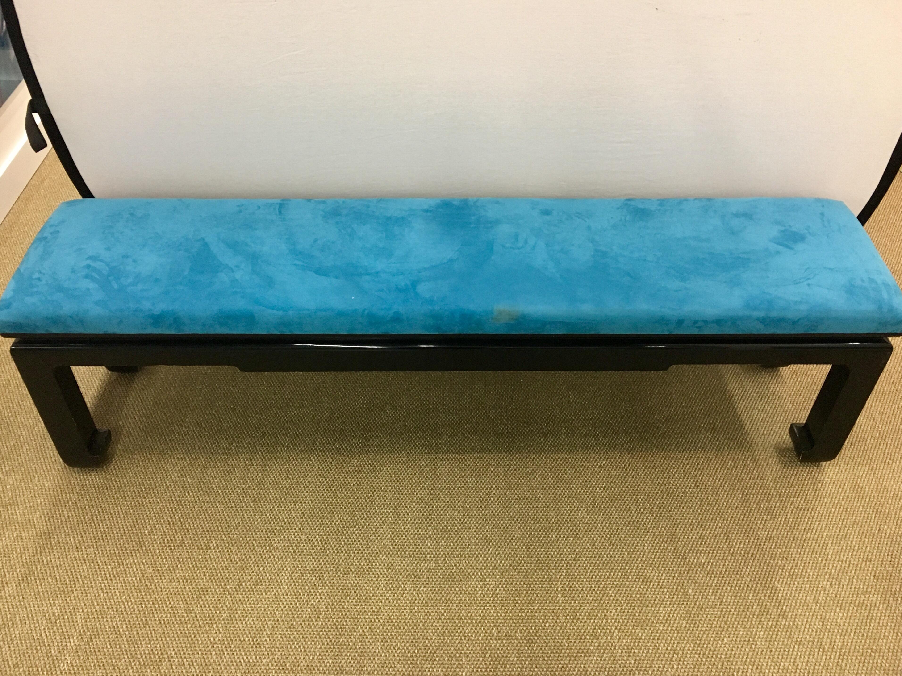 Classic long James Mont black lacquer wood bench with blue upholstery.