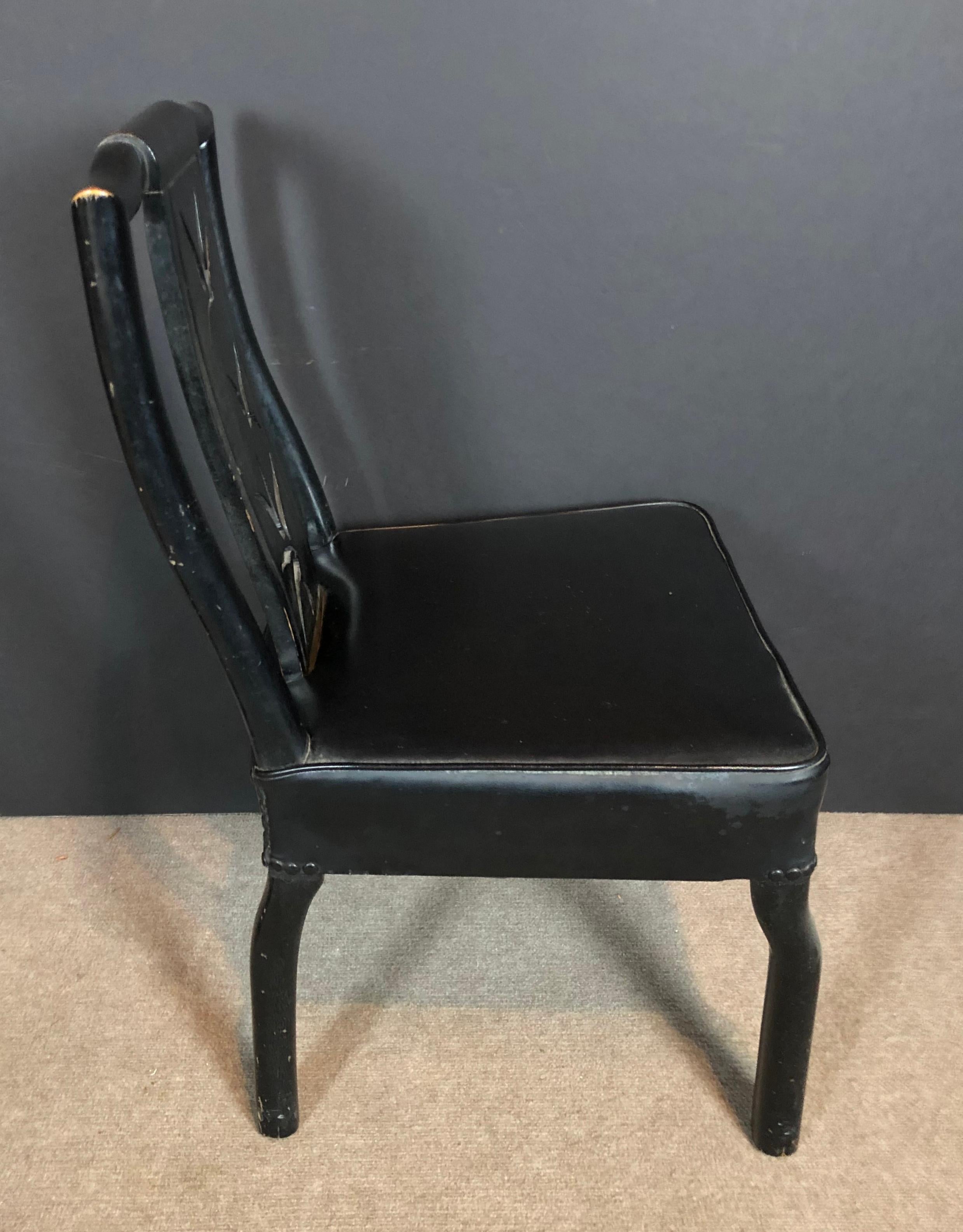 James Mont black lacquer side chair. Chinoiserie modern desk chair.
Asian style chair with cut out design, leather seat, nail head design. All original.