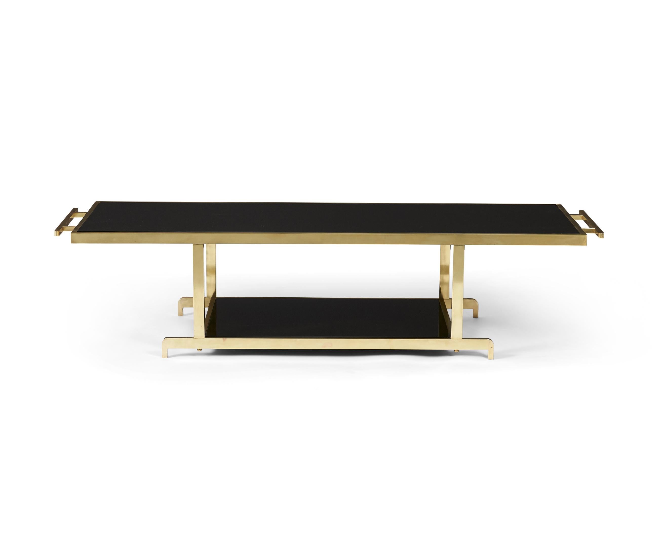 Chinoiserie coffee table by James Mont, circa 1950s. Heavy, very well made, solid brass base with black glass. Fully restored polished brass with new glass.