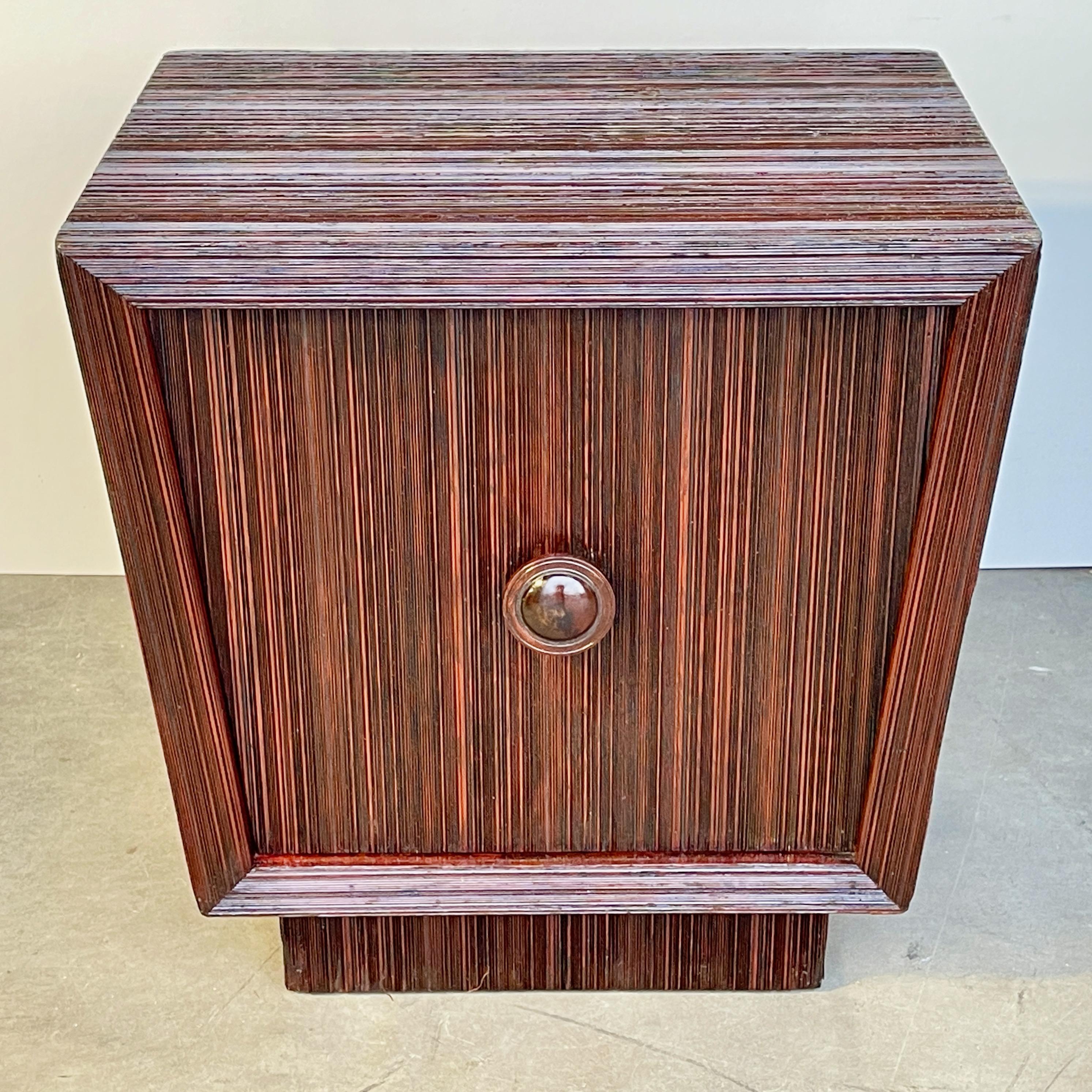 James Mont Design, signed, trapezoidal single door cabinet in pencil reed, suitable as nightstand or side cabinet. Circa 1948.
Measures 24