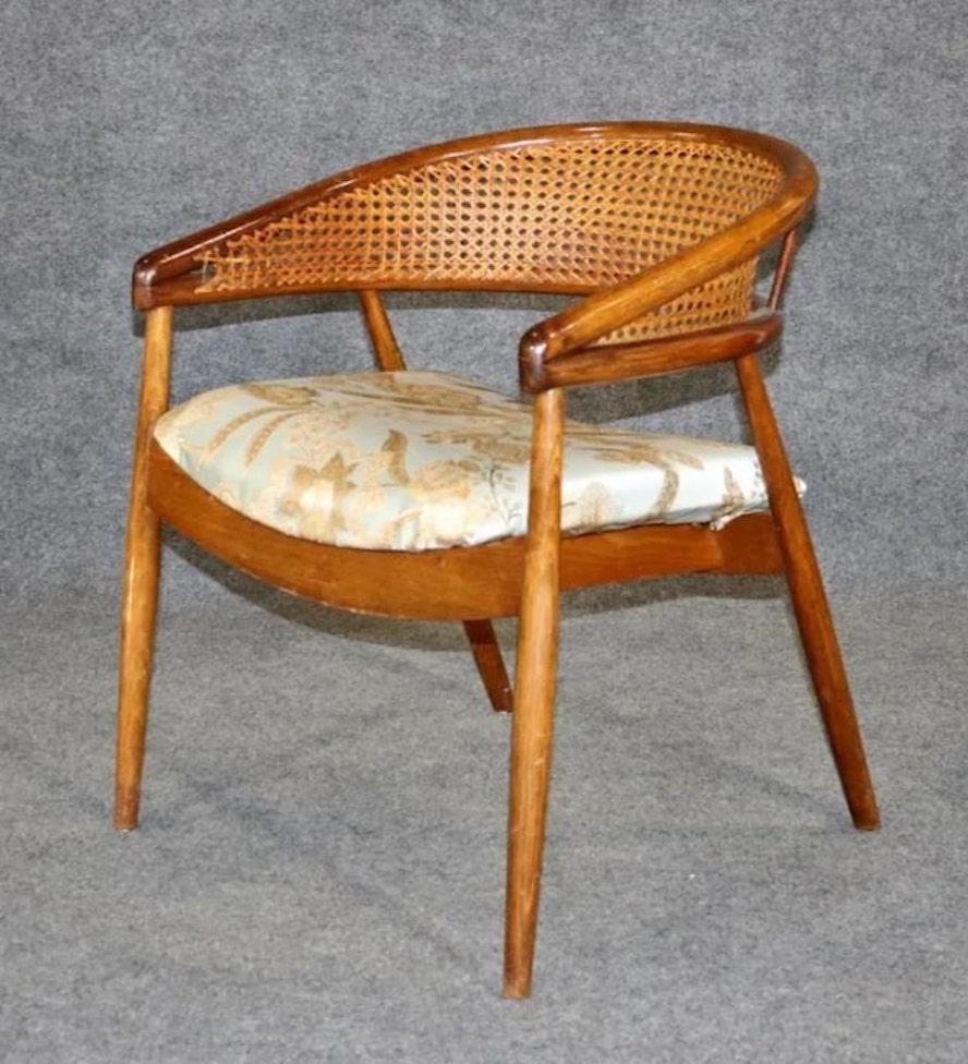 James Mont designed chair, made for the King Cole penthouse in Miami. Horseshoe wood frame with hand-woven cane back. 
Please confirm location NY or NJ