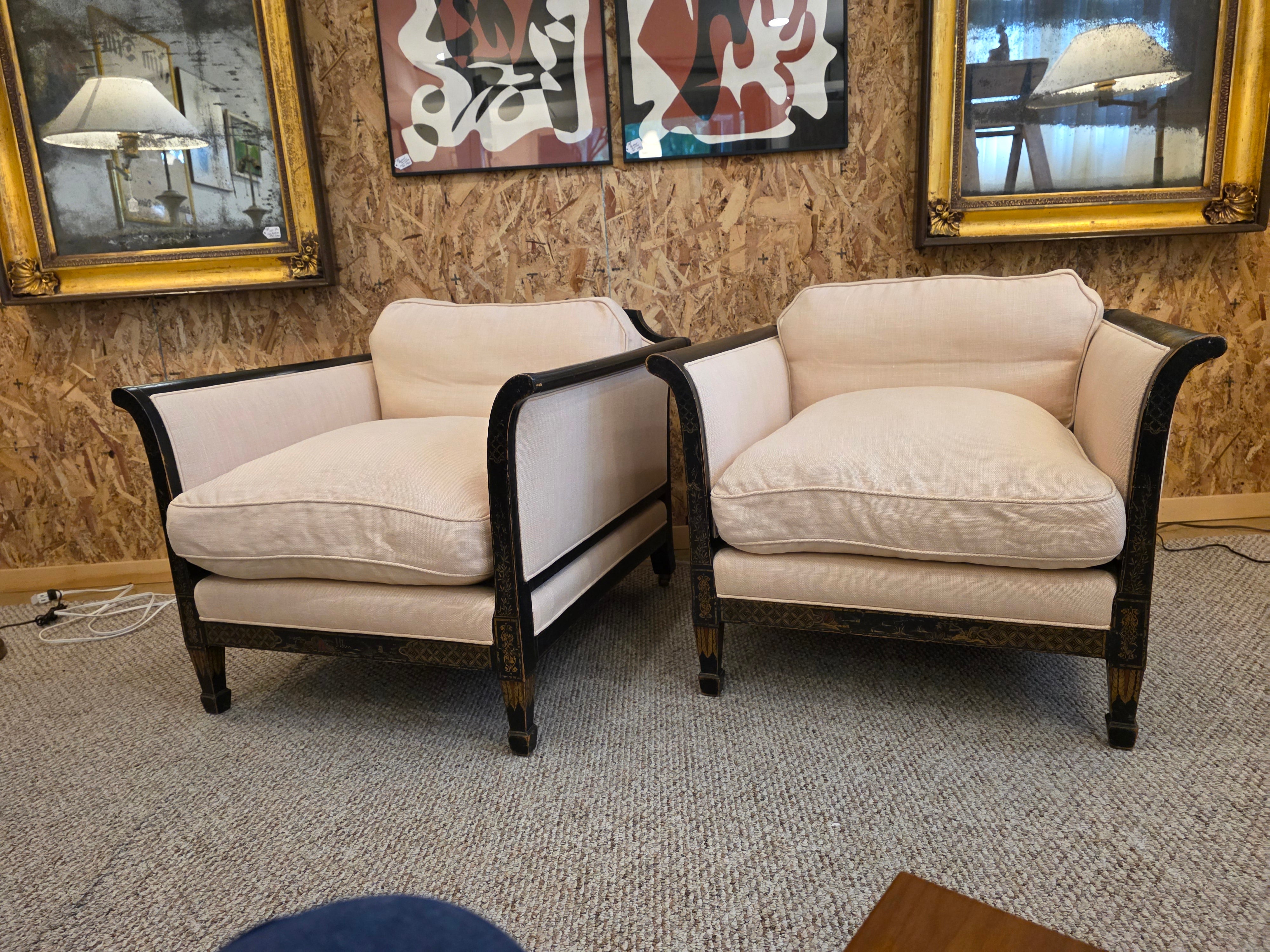 Fantastic pair of James Mont inspired, Art Deco Lounge chairs. With ebonized and paint decorated surface. The somewhat neoclassical design with Asian Flair adds a tremendous form of Elegance to this pair of chairs. Completely reupholstered with down