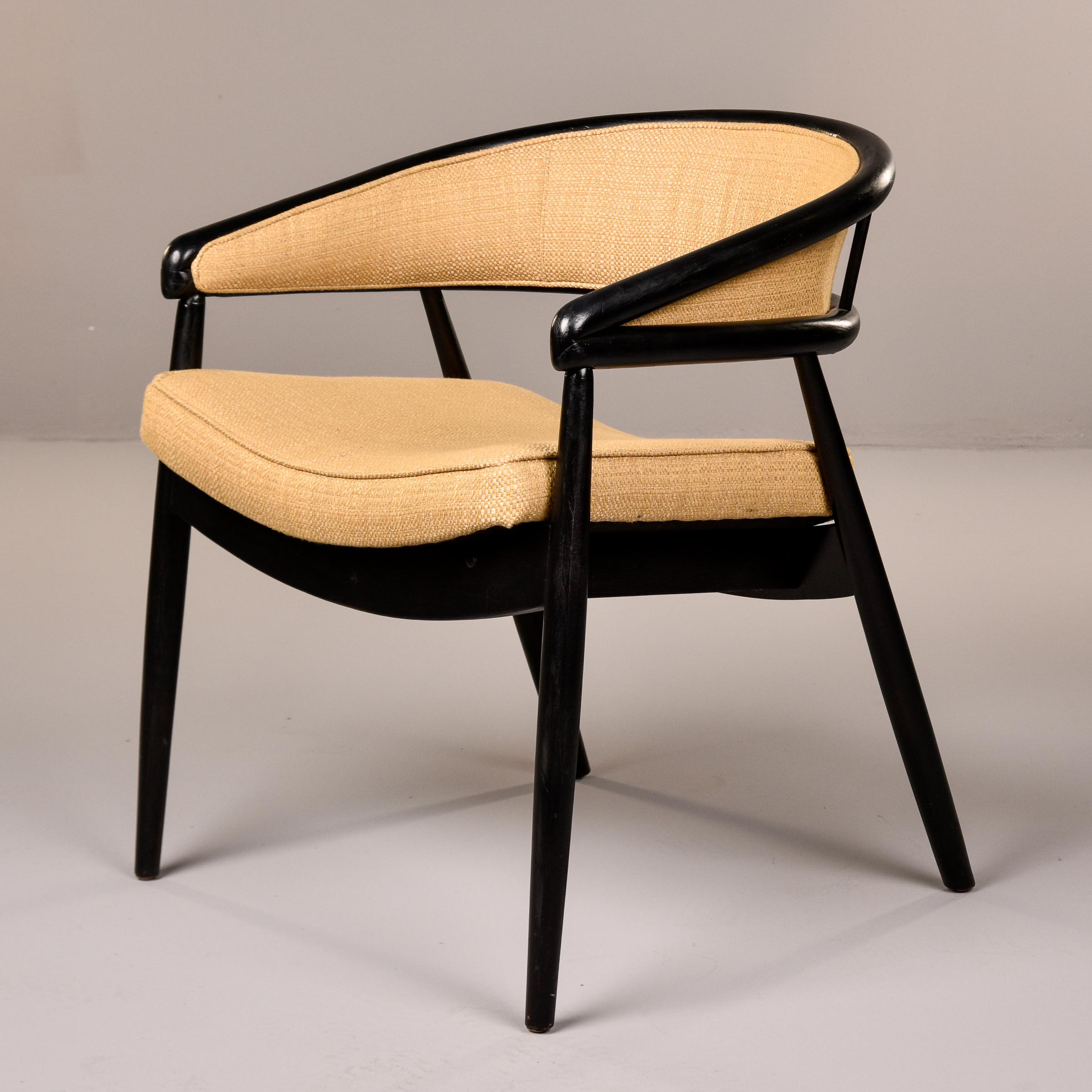 Found in the US, this circa late 1950s/early 1960s James Mont style chair has a black painted bentwood frame and new upholstery. Wrap-around curved back rest features distinctive tight bentwood corners with canted and tapered back legs. The subtle